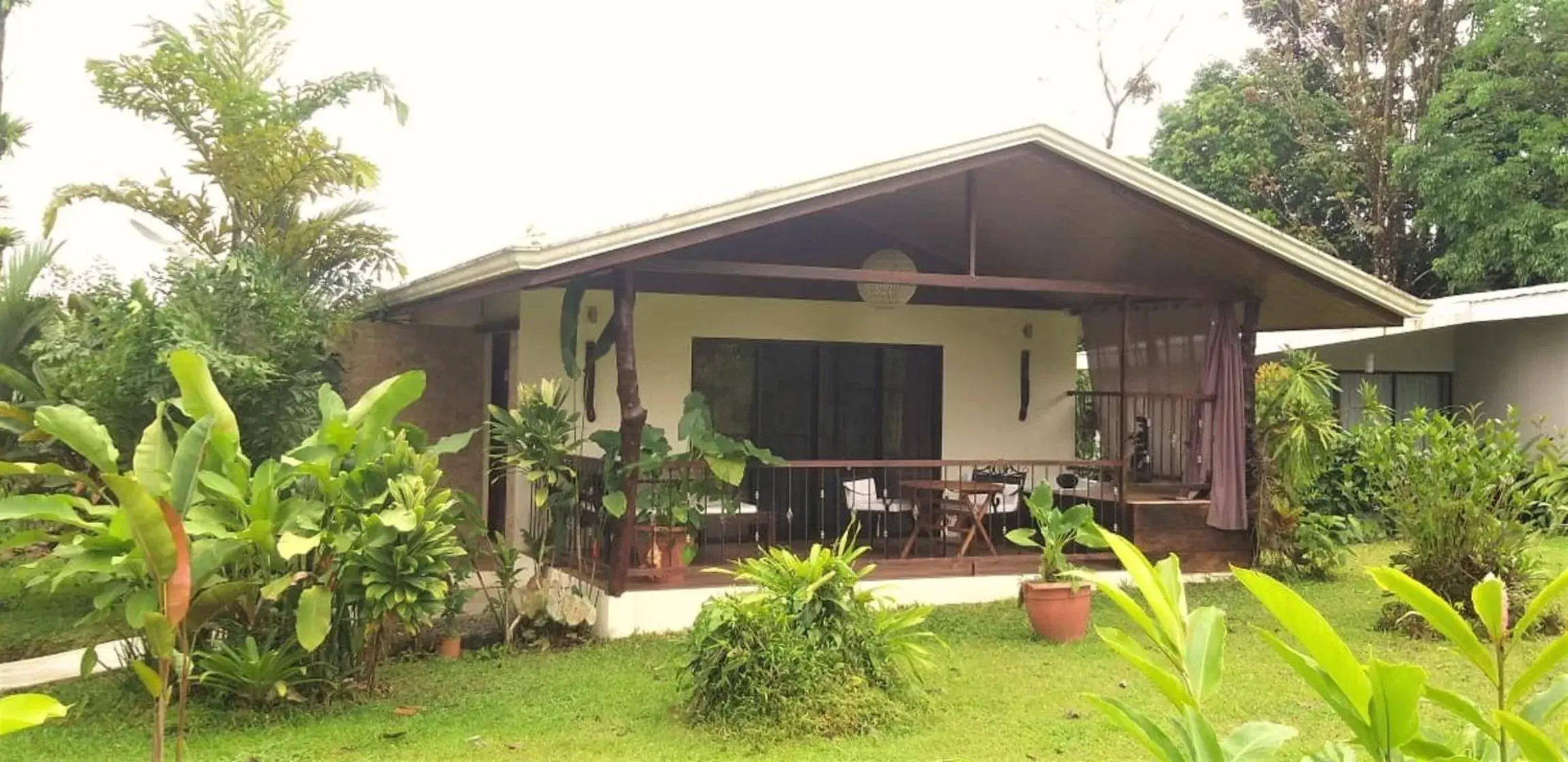 Property building in Tropical Suites & Villas