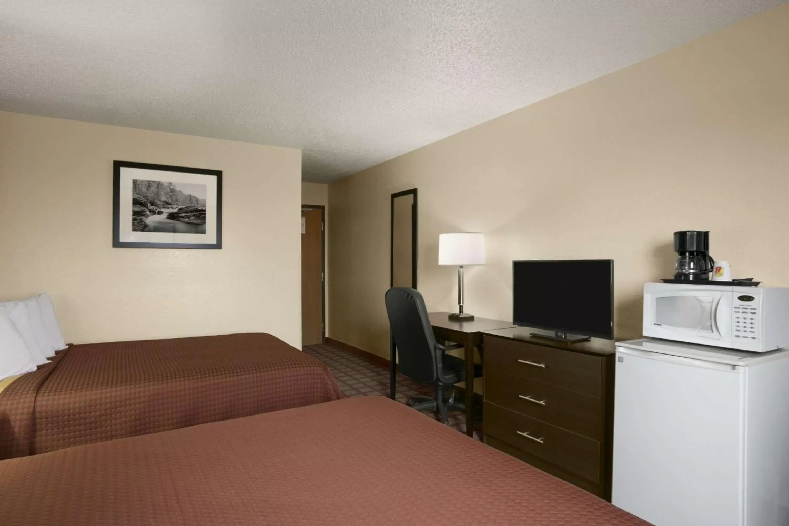 Photo of the whole room, TV/Entertainment Center in Super 8 by Wyndham Saginaw