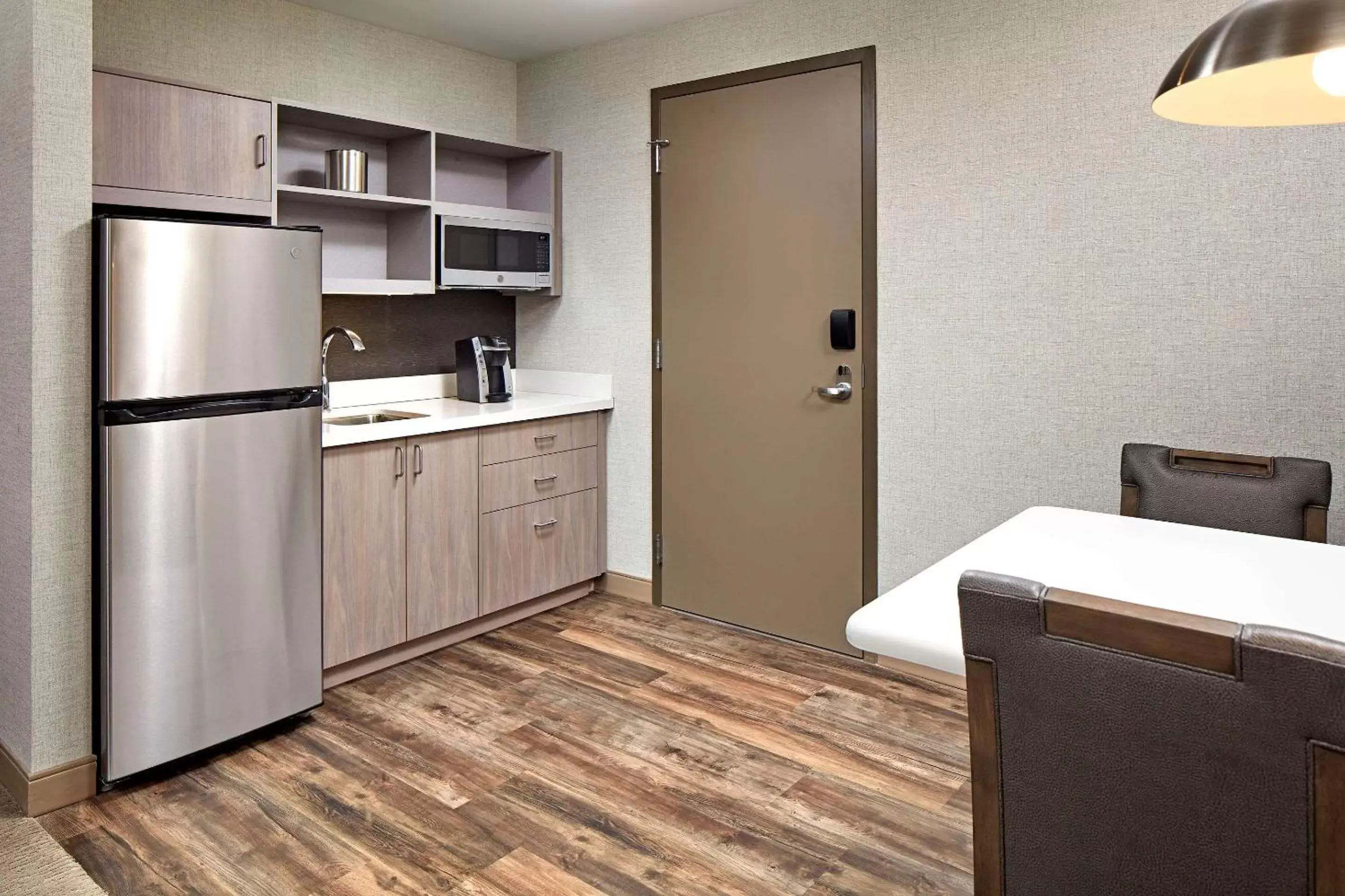 Bedroom, Kitchen/Kitchenette in Cambria Hotel & Suites Anaheim Resort Area