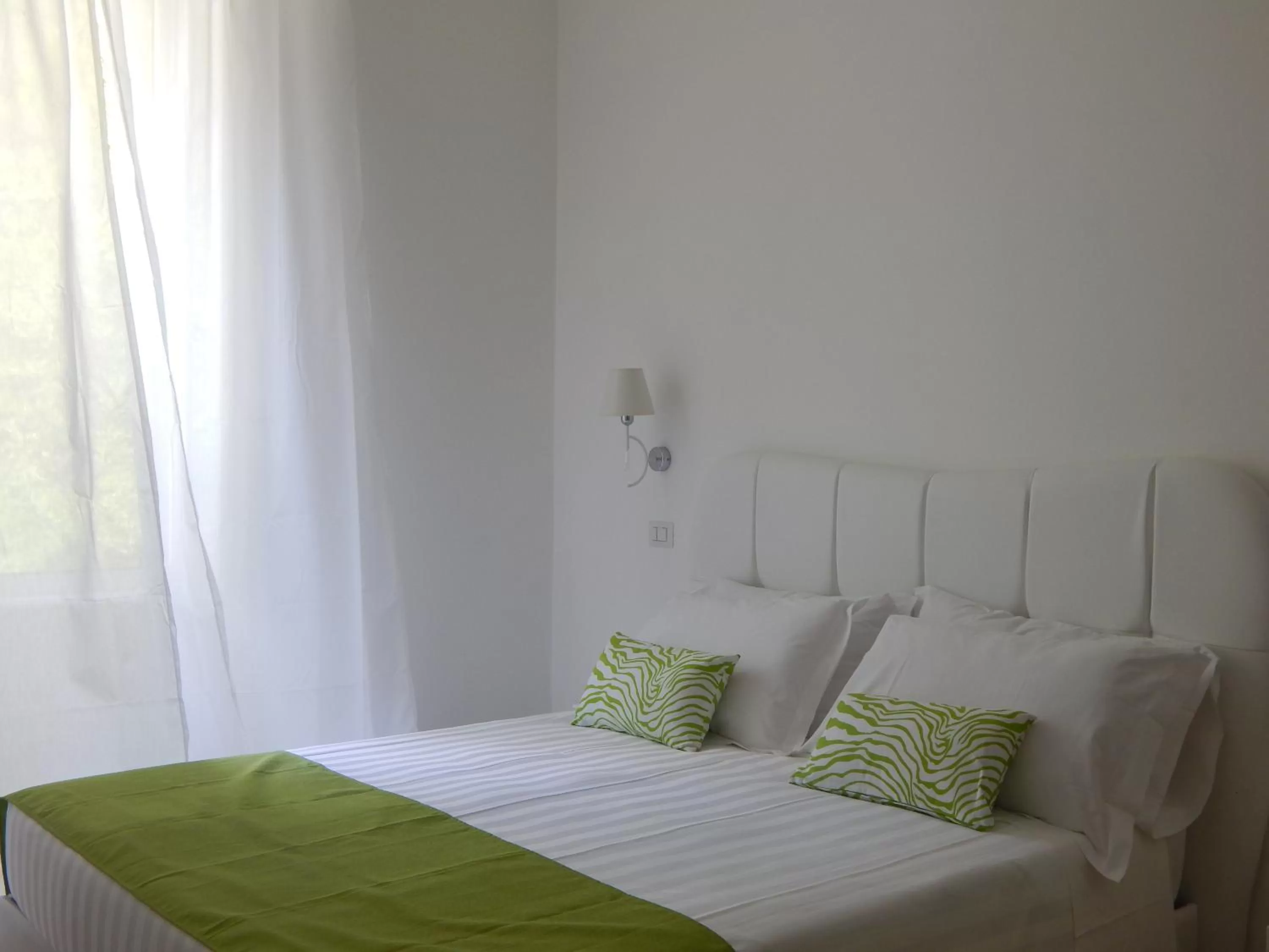 Bed in Roma Resort Colosseum