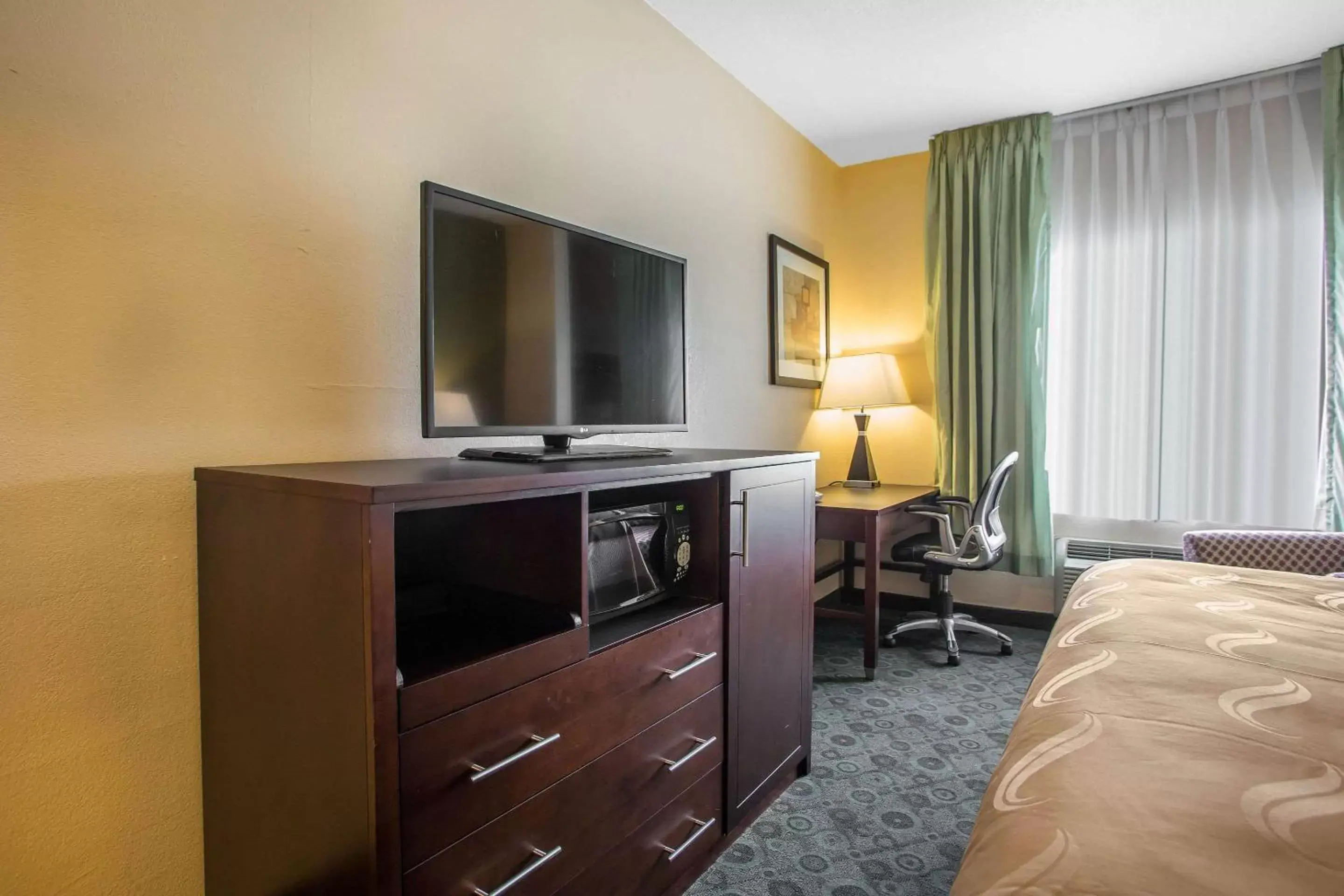 Photo of the whole room, TV/Entertainment Center in Quality Inn & Suites Bloomington I-55 and I-74