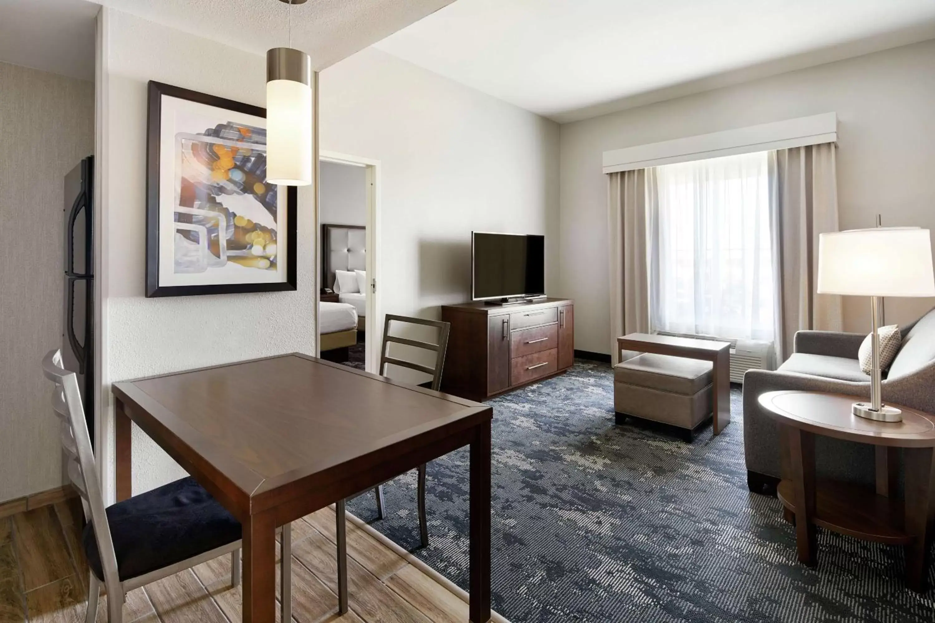 Bedroom, Seating Area in Homewood Suites Champaign-Urbana