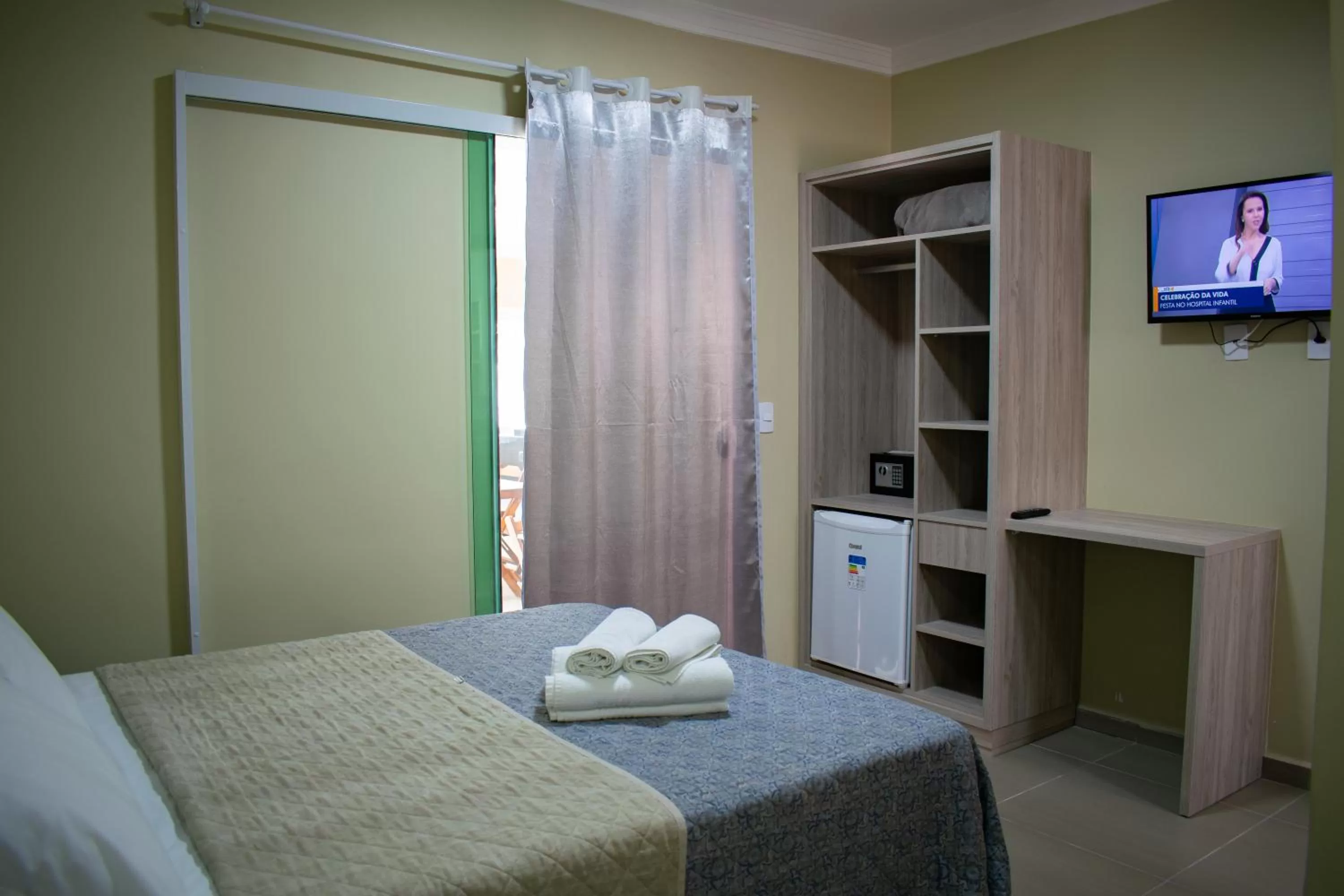 Bed in Pousada Tissiano