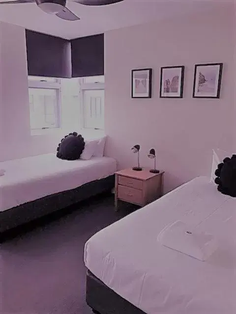 Bed in Sunrise Luxury Apartments