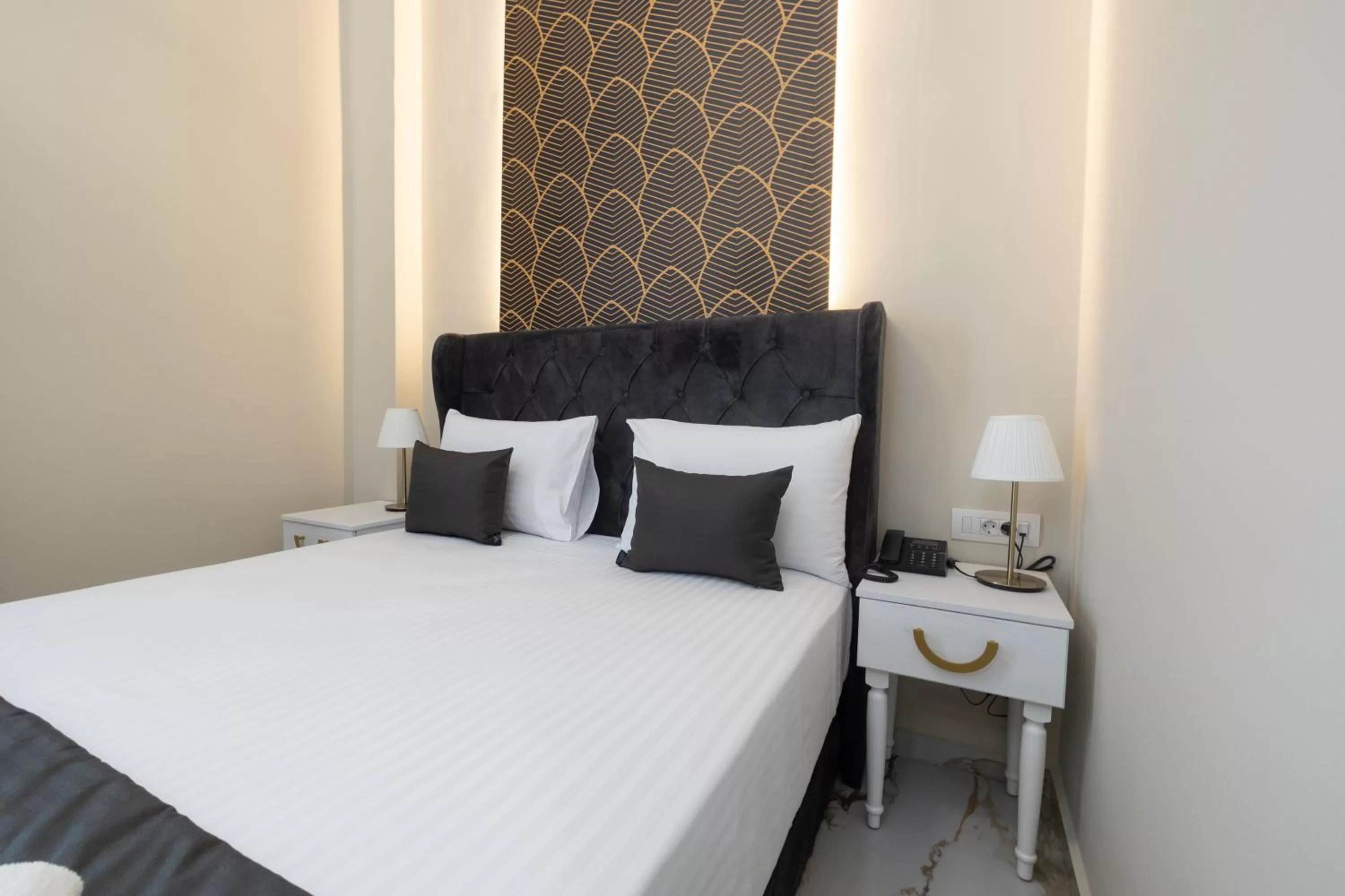 Bed in Modern Revival Luxury Hotel