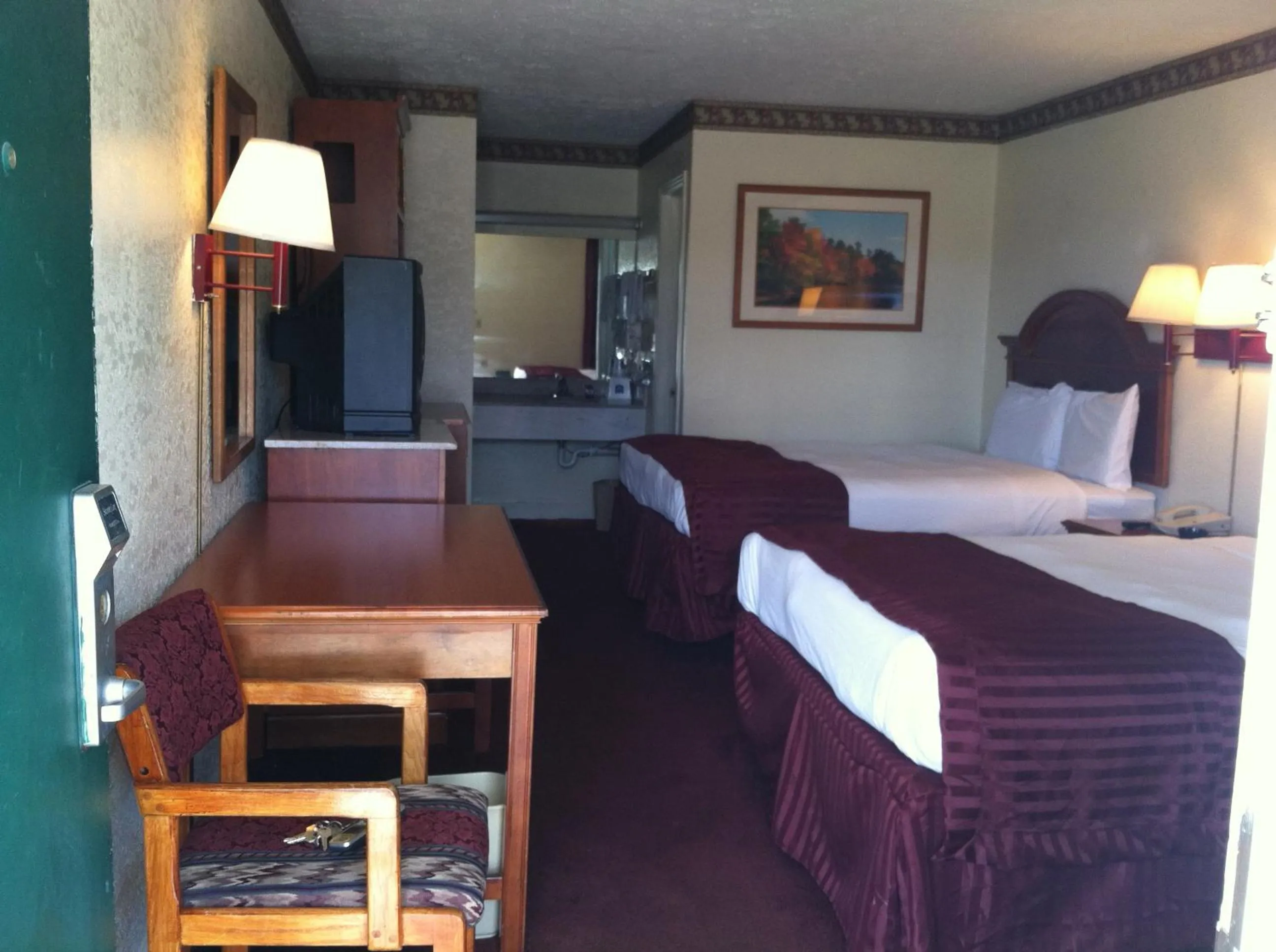 Bed in Knights Inn Hurricane Mills