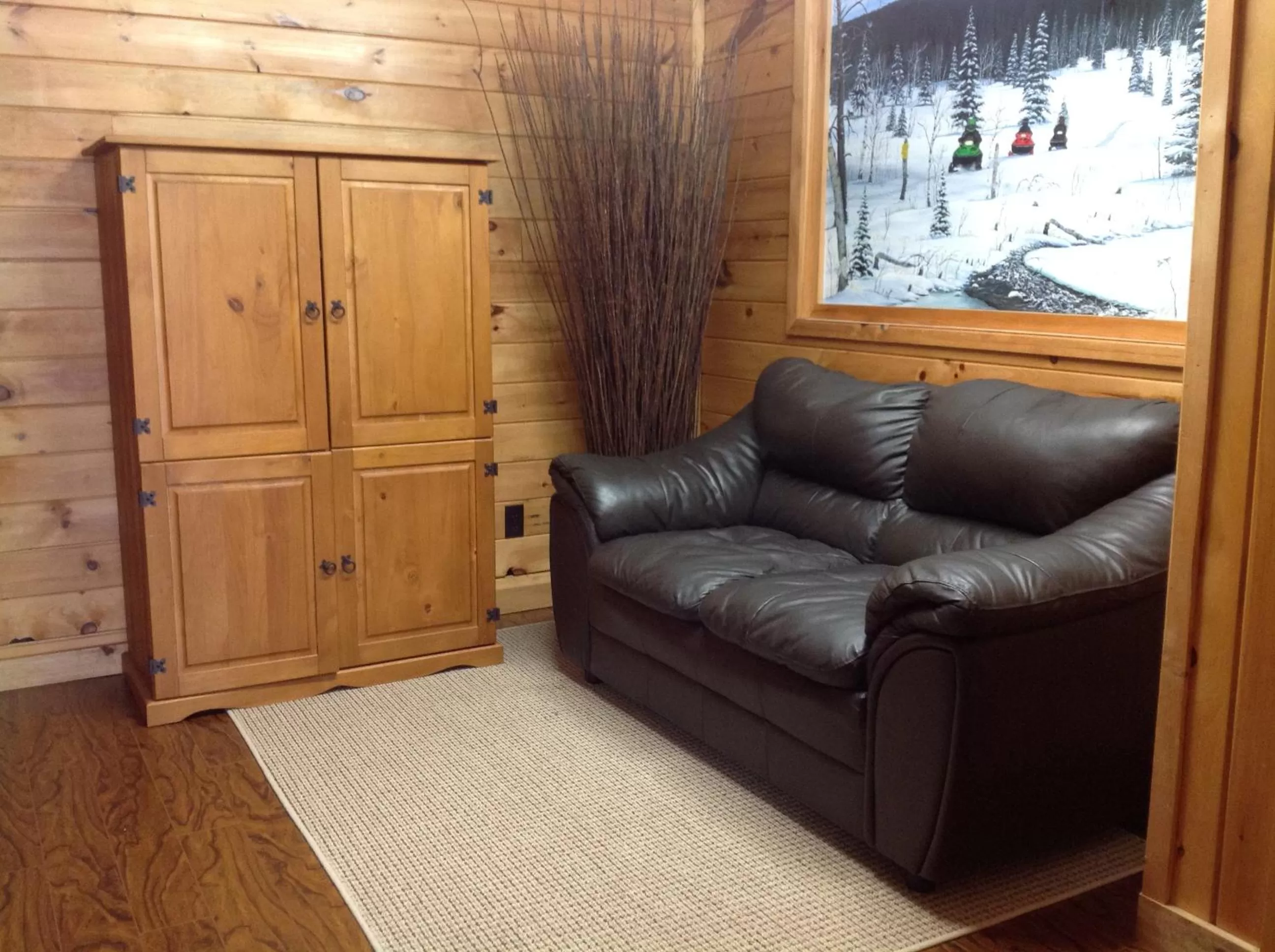 Communal lounge/ TV room in Madawaska Lodge