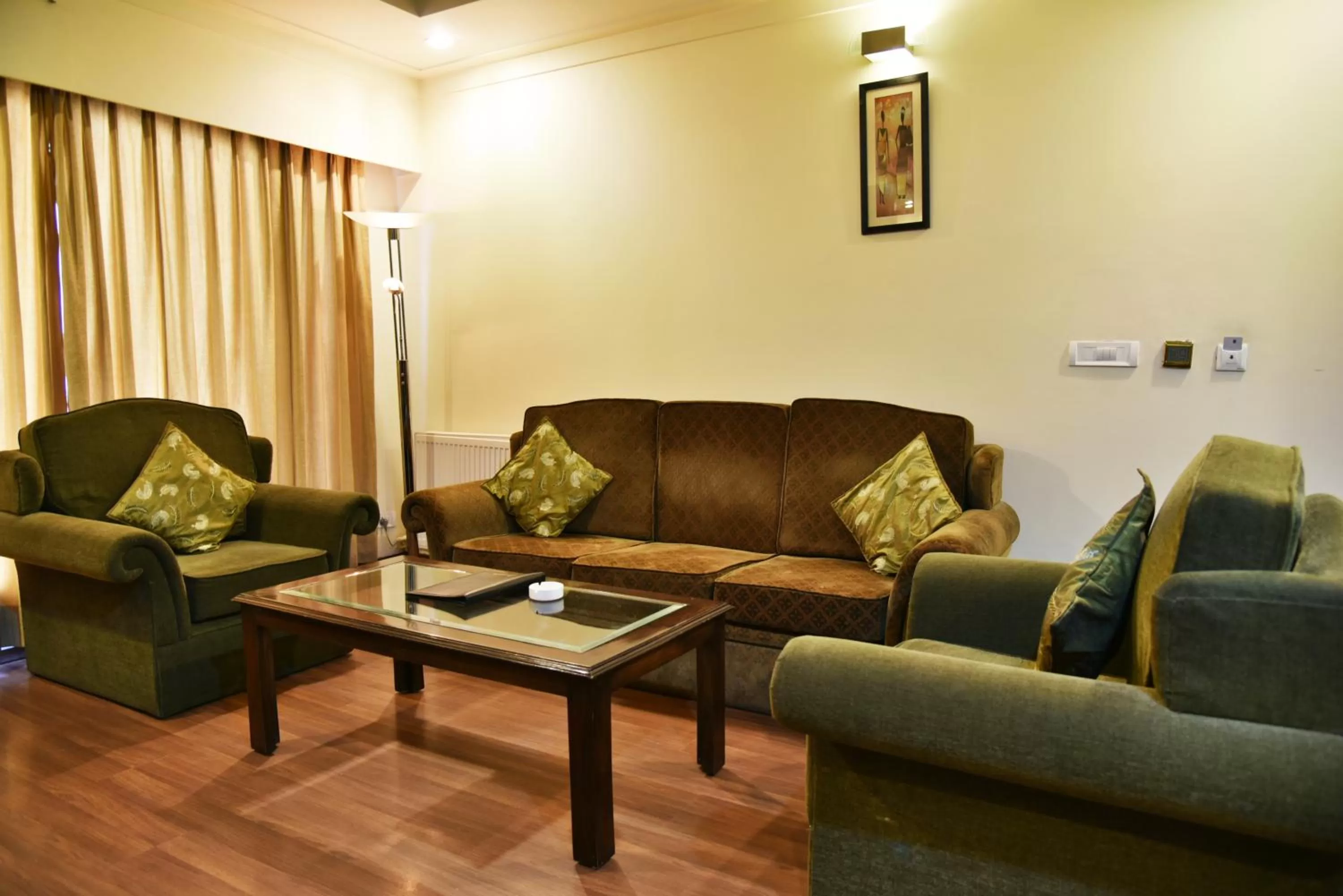 Living room in Indraprastha Resort - Centrally Heated Rooms, with Gym, Games & Spa