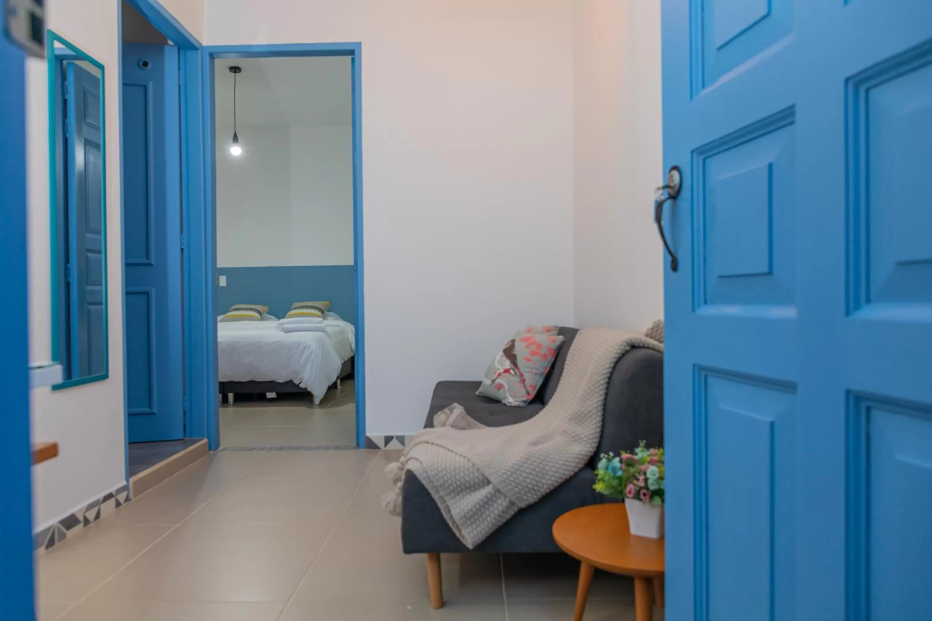 Living room, Bed in Hotel Azulado Jericó