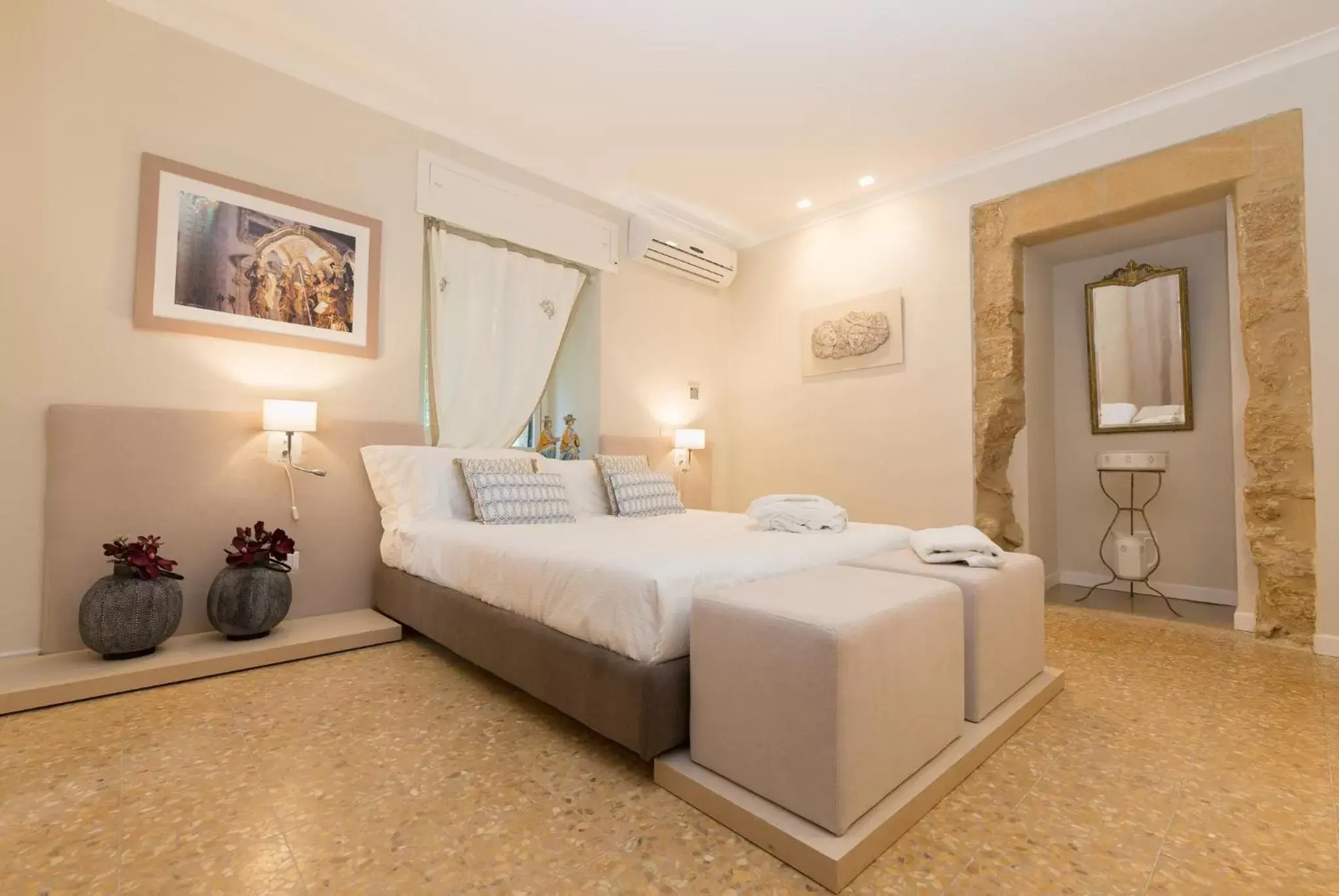 Bed in Palazzo Taranto Luxury Rooms