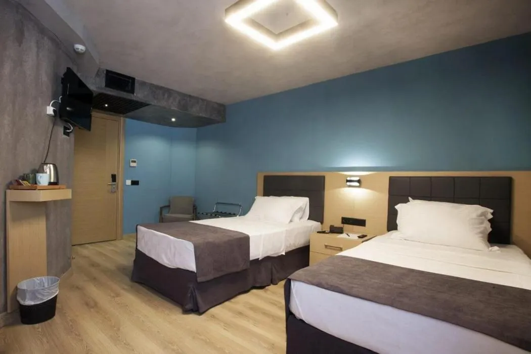 Bed in Red Stone Hotel