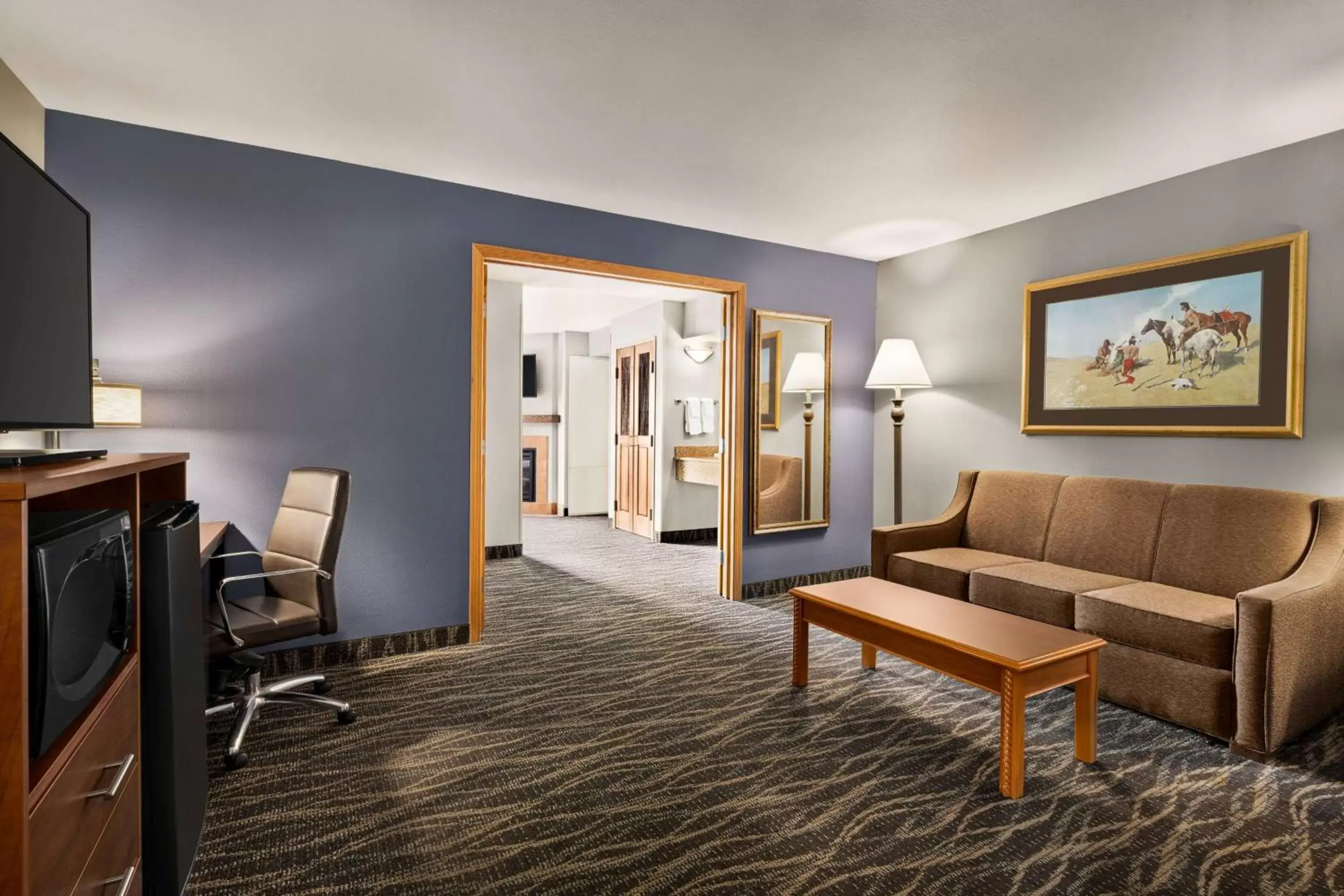 Bed, Seating Area in AmericInn by Wyndham Laramie Near University of Wyoming