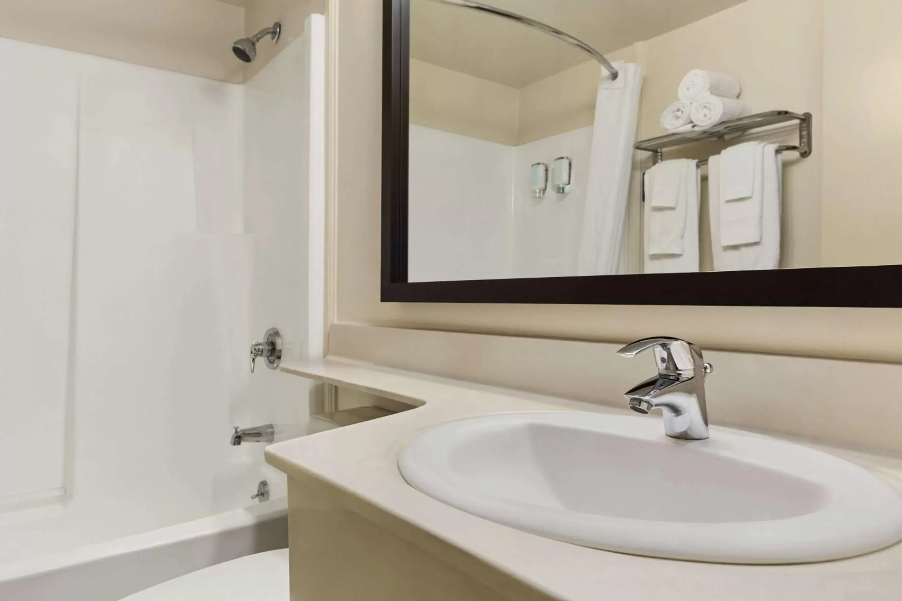 Bathroom in Travelodge Suites by Wyndham Saint John