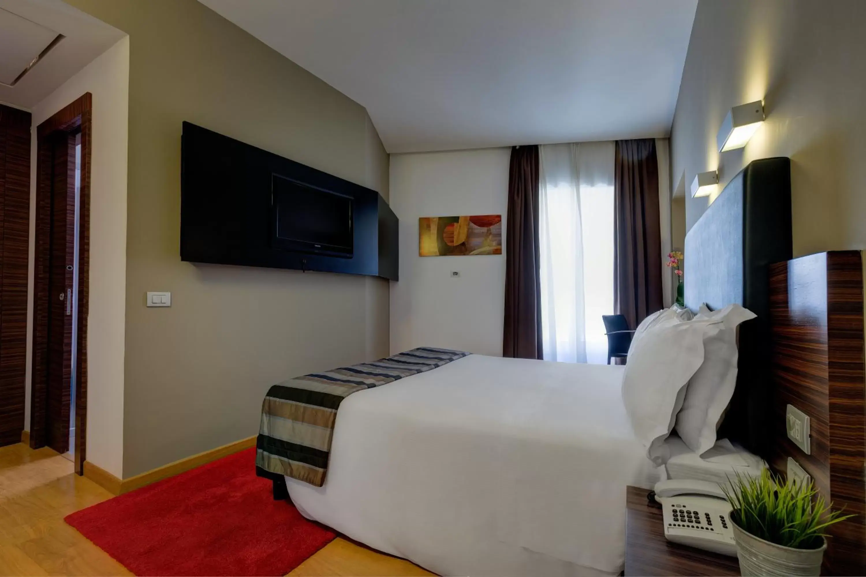 Bed, TV/Entertainment Center in Trevi Collection Hotel - Gruppo Trevi Hotels
