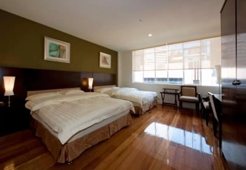 Bed in YTI Garden Hotel