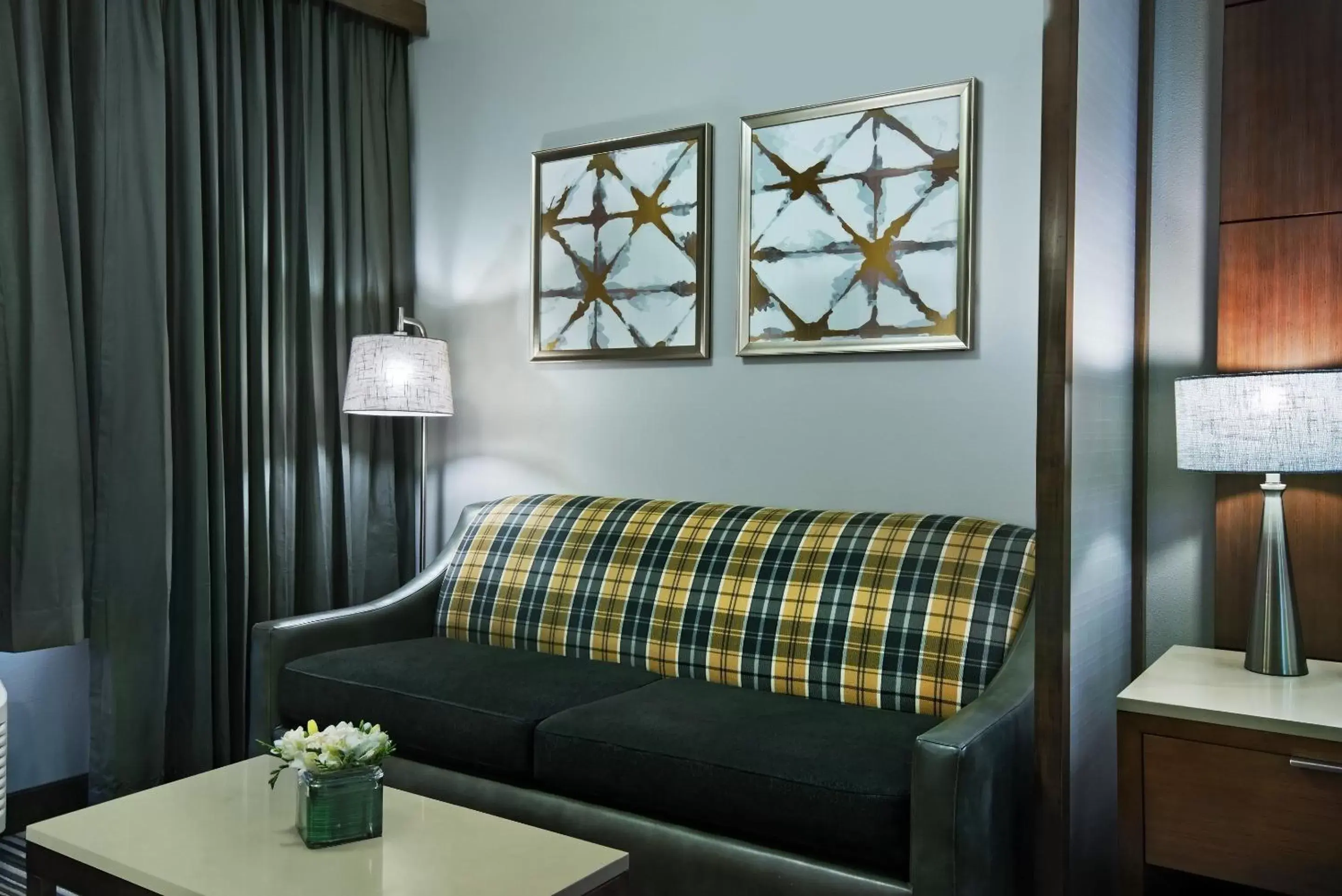 Seating area, Bed in Oxford Suites Spokane Downtown Seating area, Bed in Oxford Suites Spokane Downtown