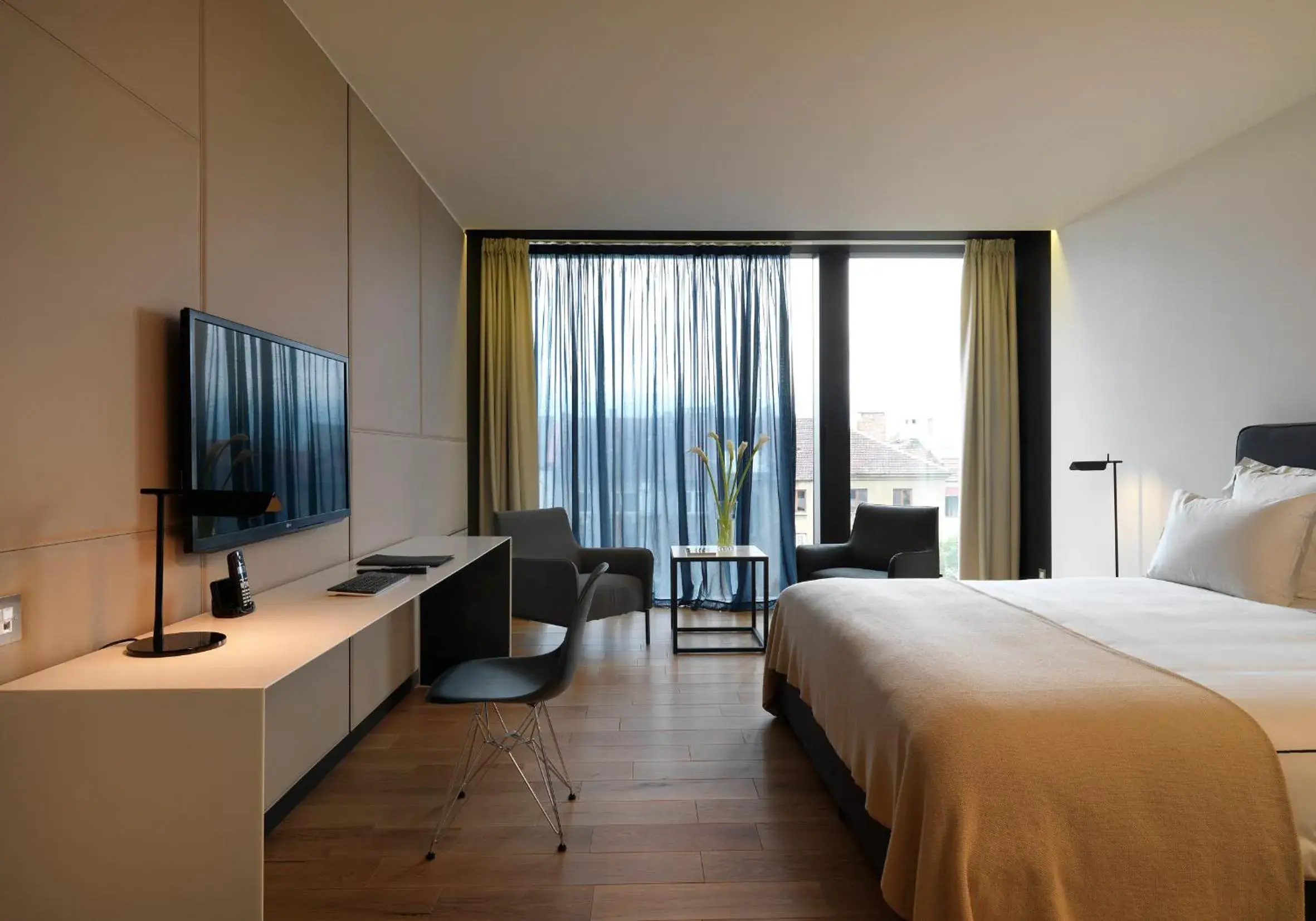 Bed, TV/Entertainment Center in Sense Hotel Sofia, a Member of Design Hotels