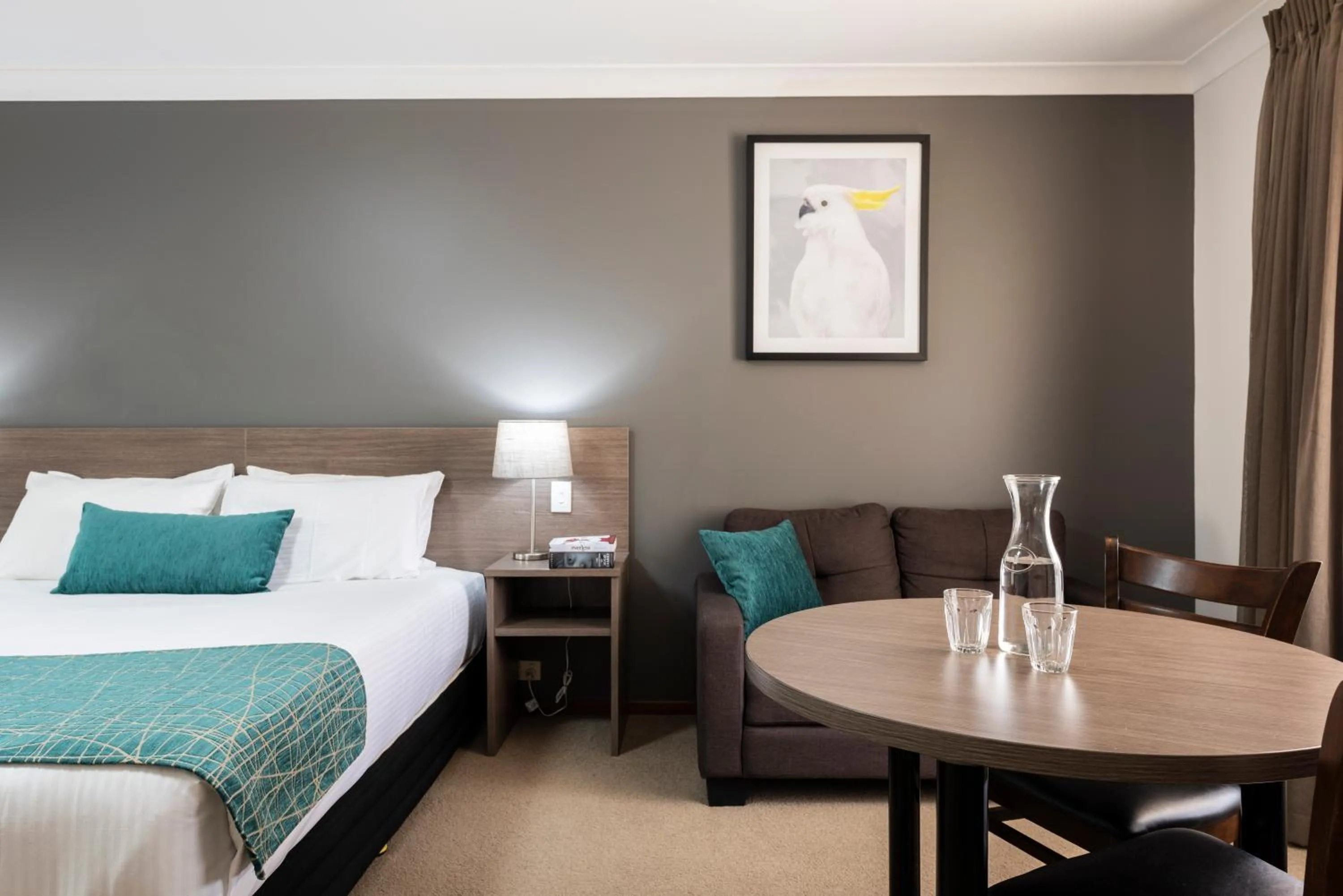 Seating area, Bed in Best Western Plus Ambassador Orange