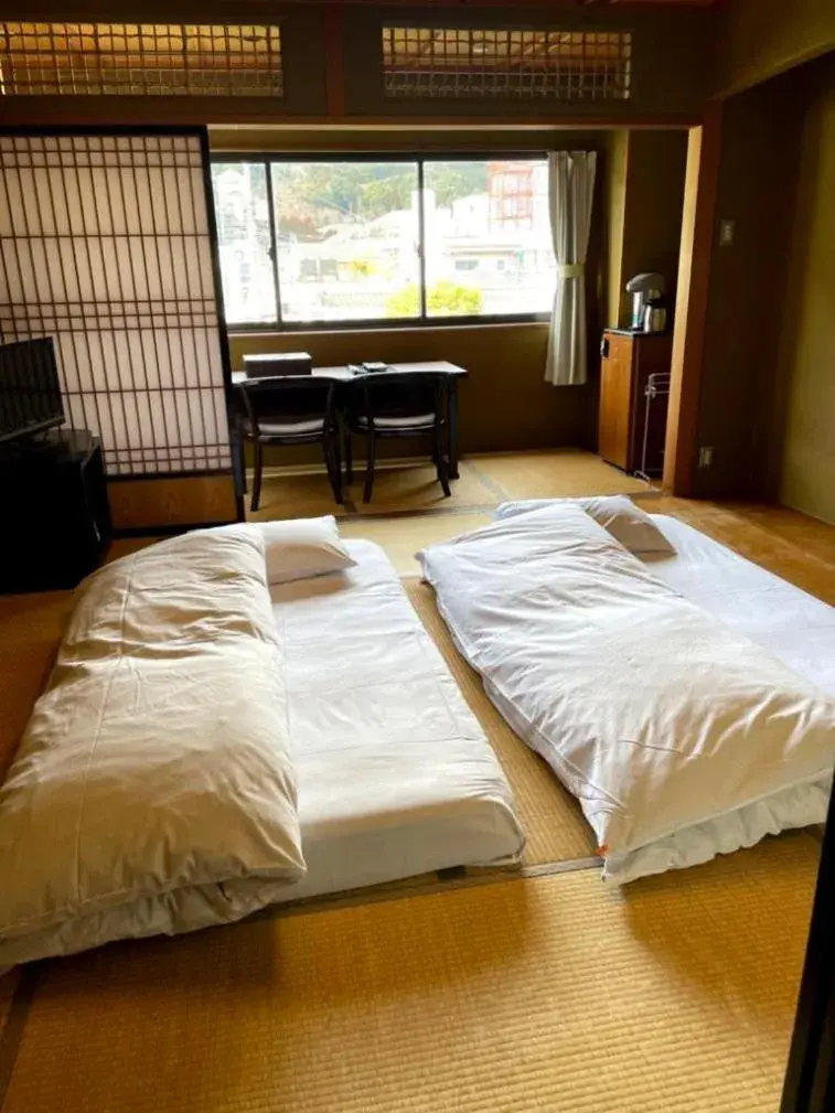Bed in Kyotoya Hotel