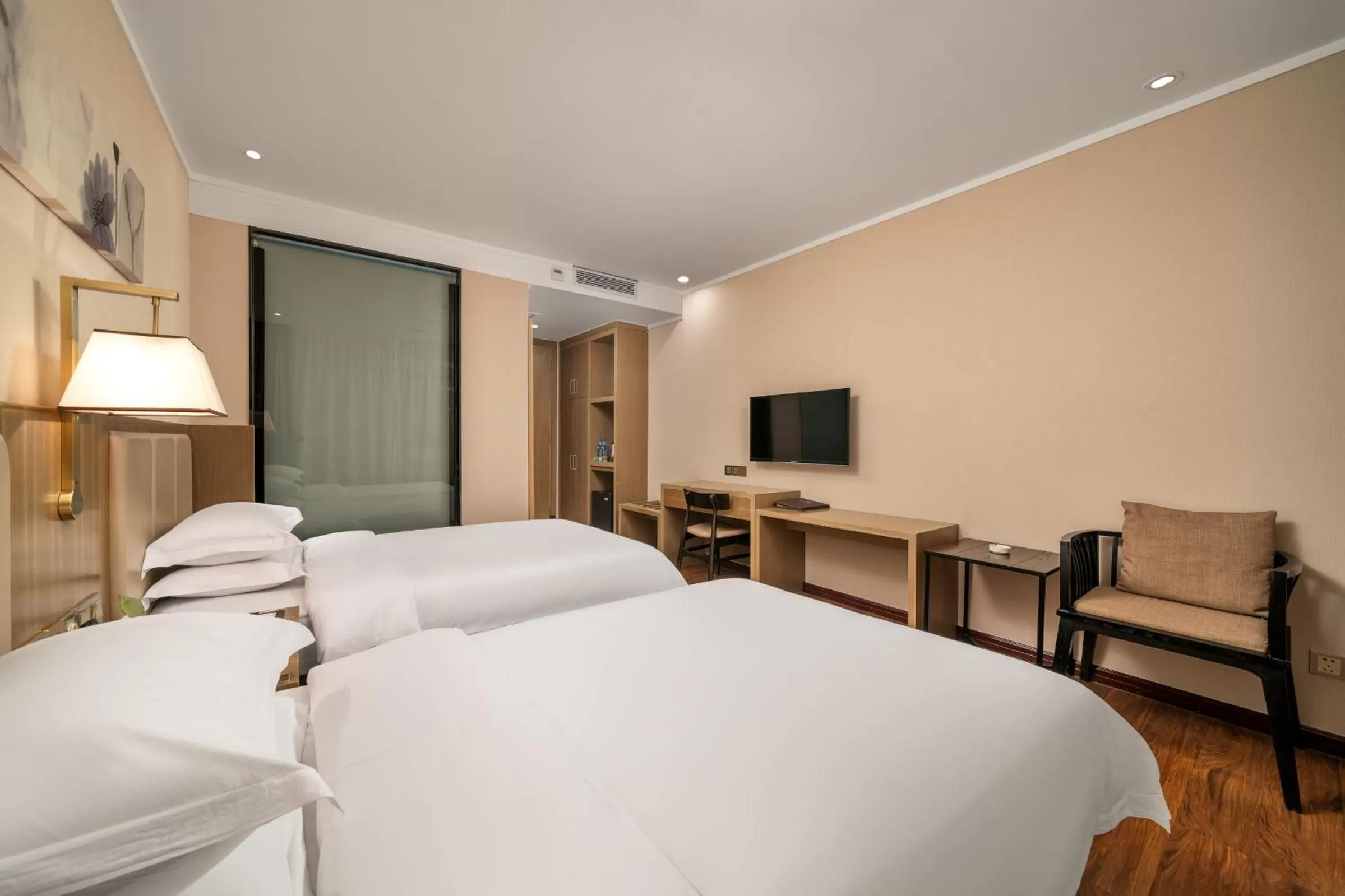 Bed in Guangzhou Boyi Hotel