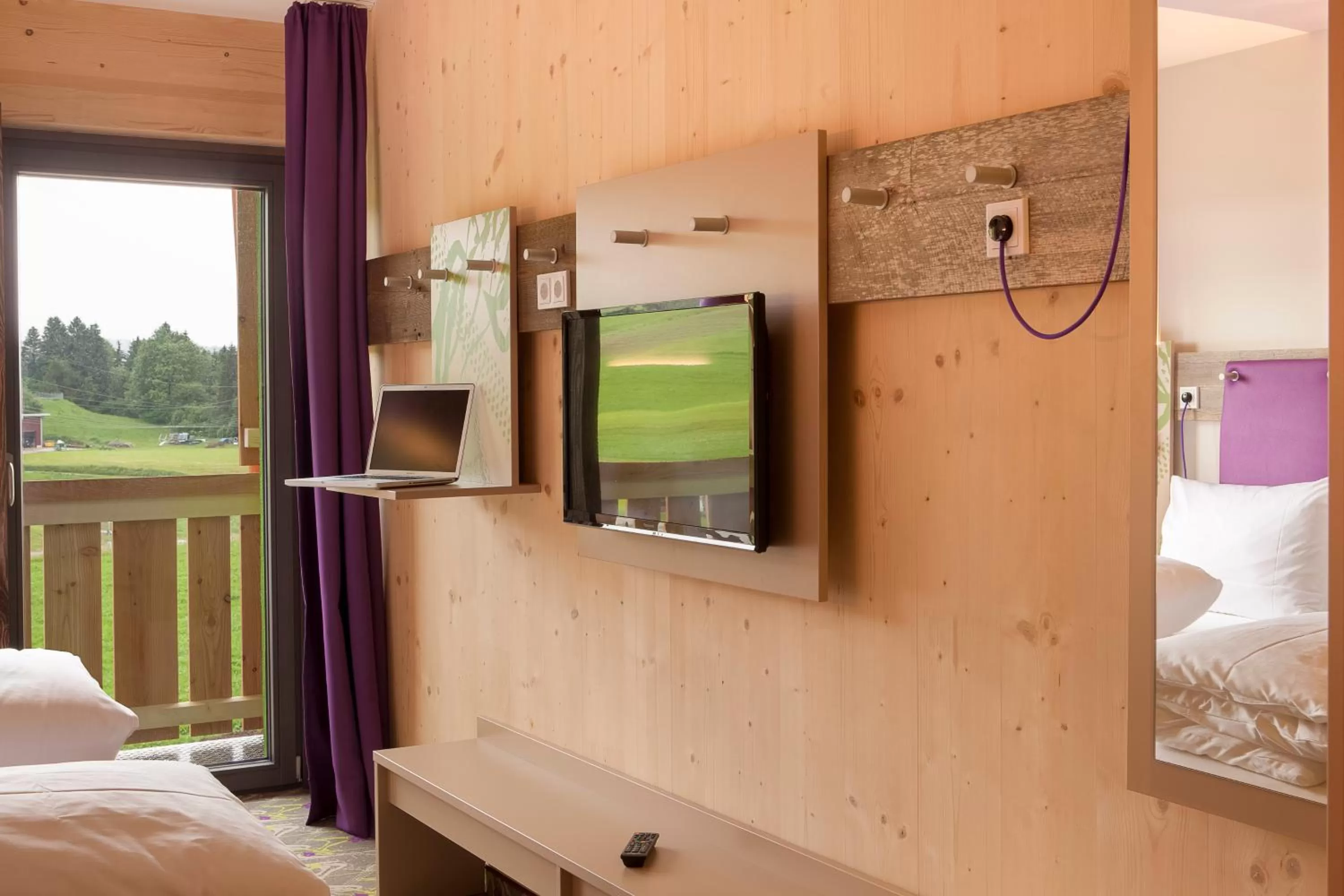 Living room, Bed in Explorer Hotel Neuschwanstein