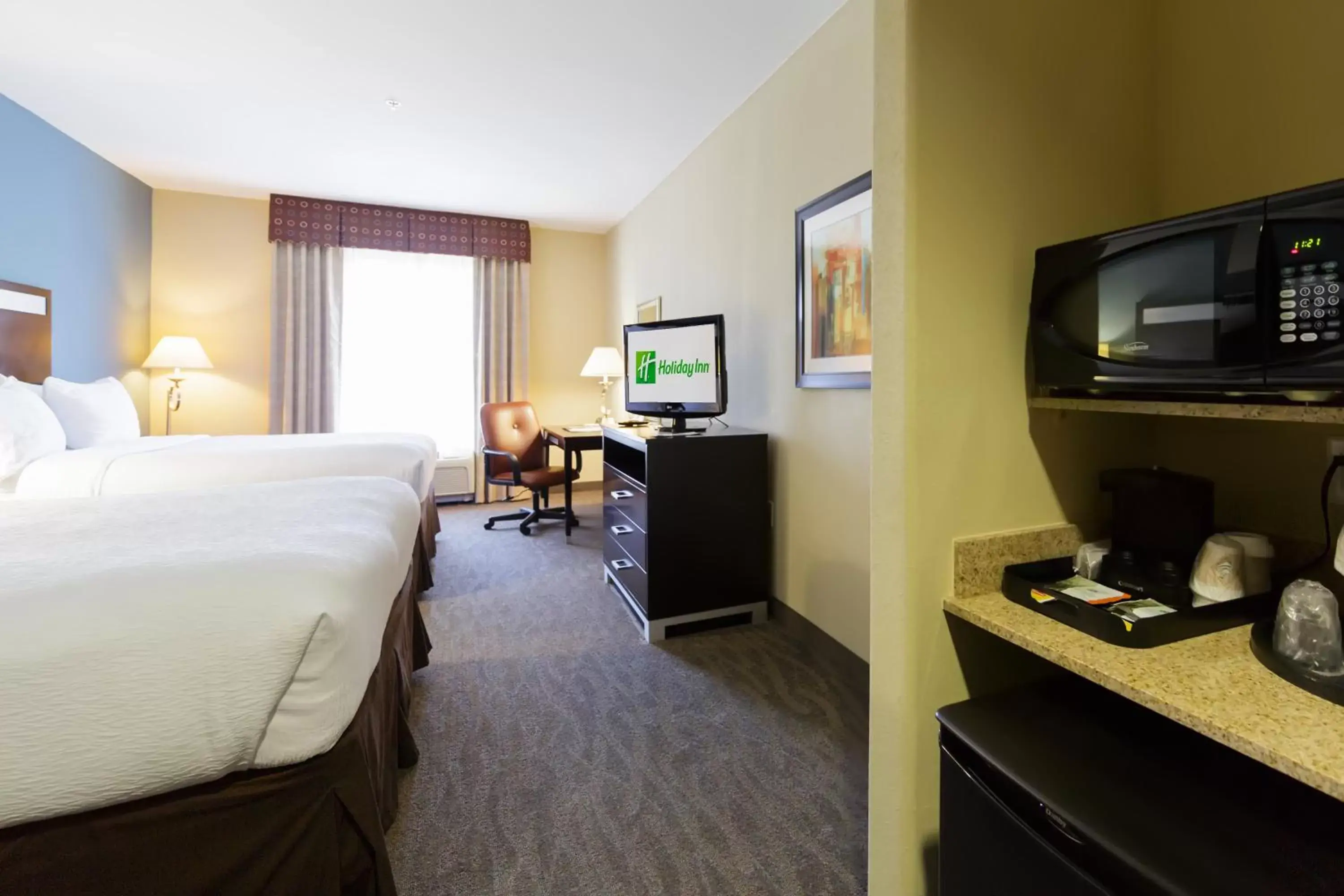 Photo of the whole room, TV/Entertainment Center in Holiday Inn Houston-Webster, an IHG Hotel