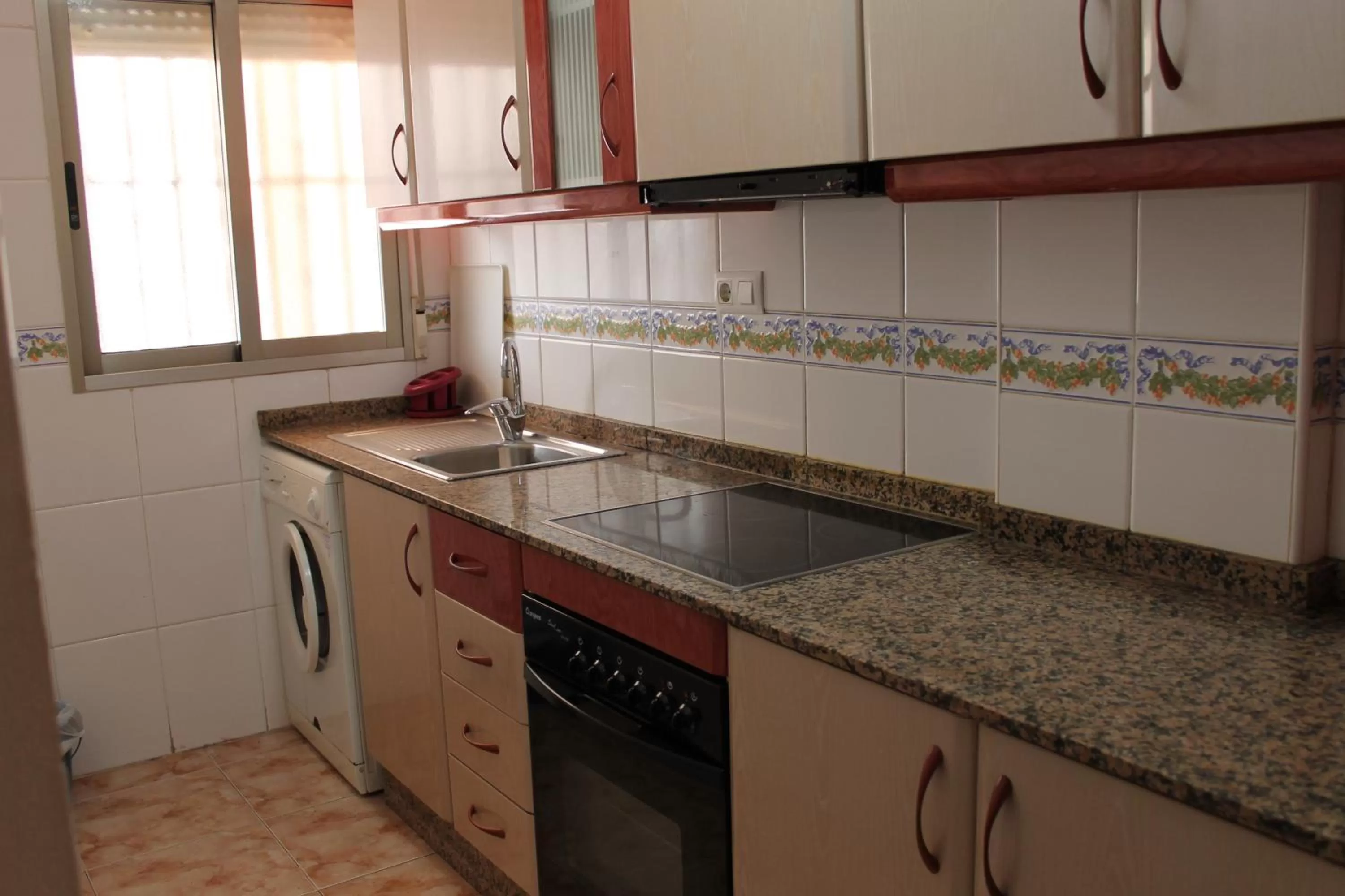 Kitchen or kitchenette in Apartamentos Turísticos Fresno