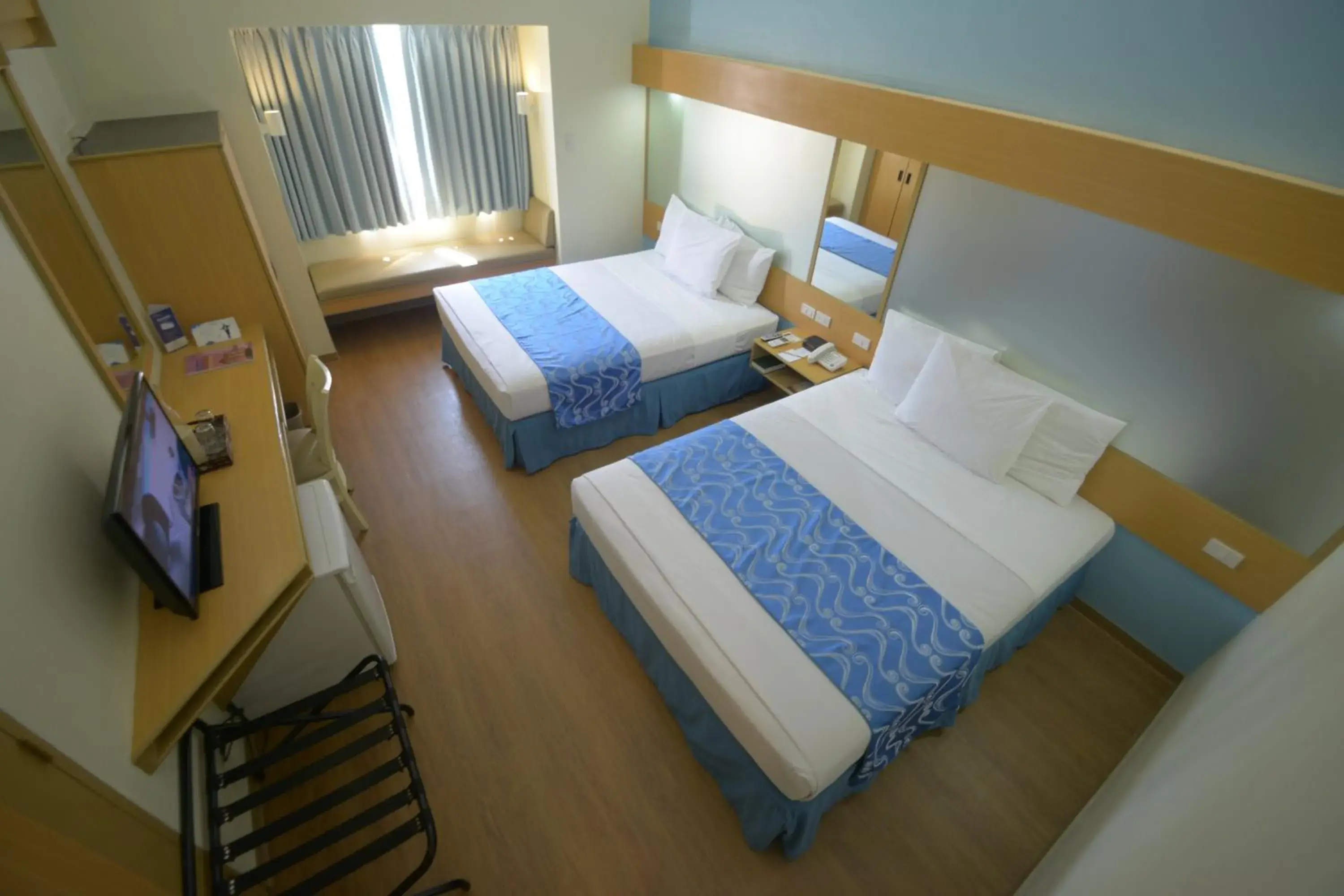 Photo of the whole room, Bed in Microtel by Wyndham Davao