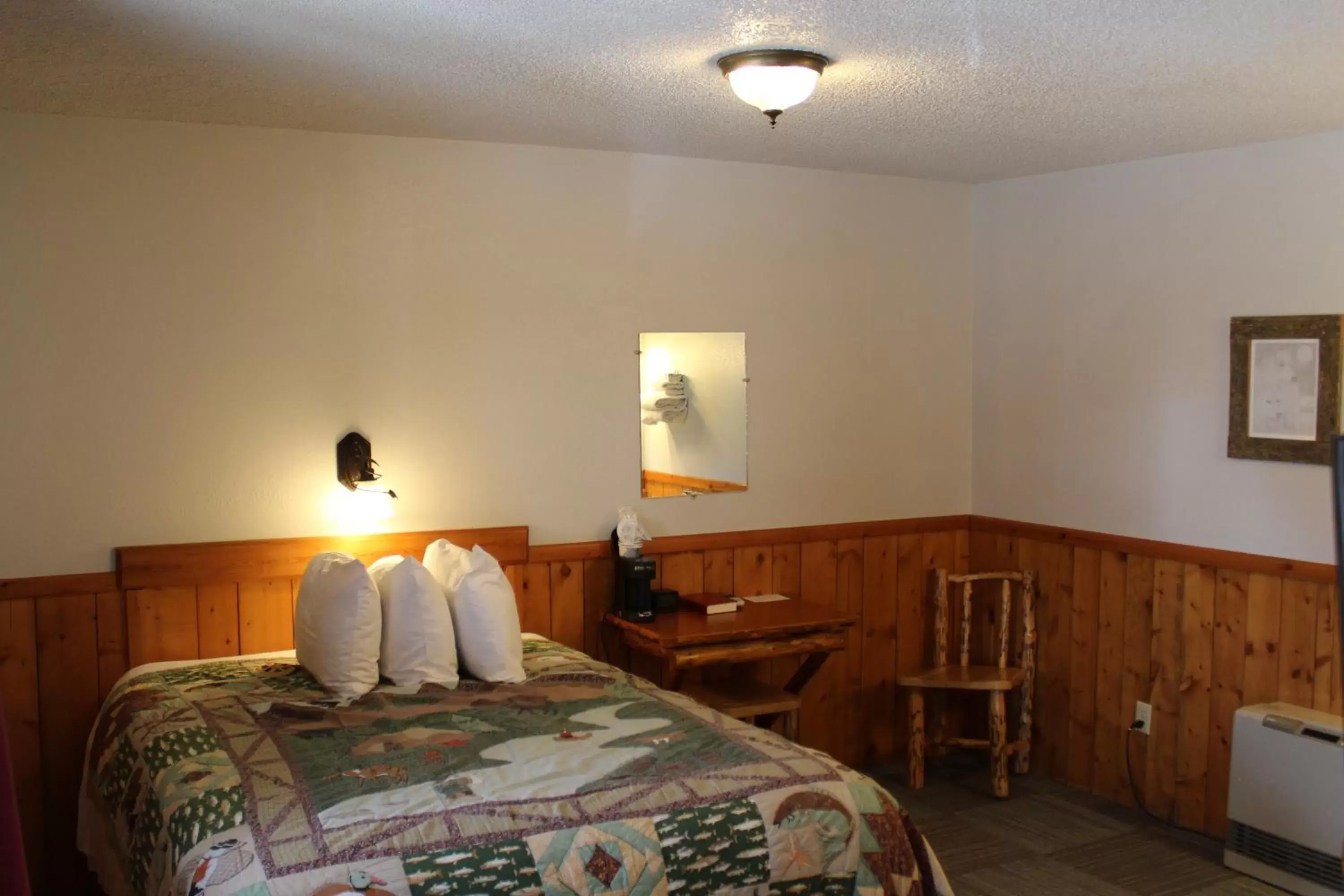 Bed in Alpine Motel of Cooke City