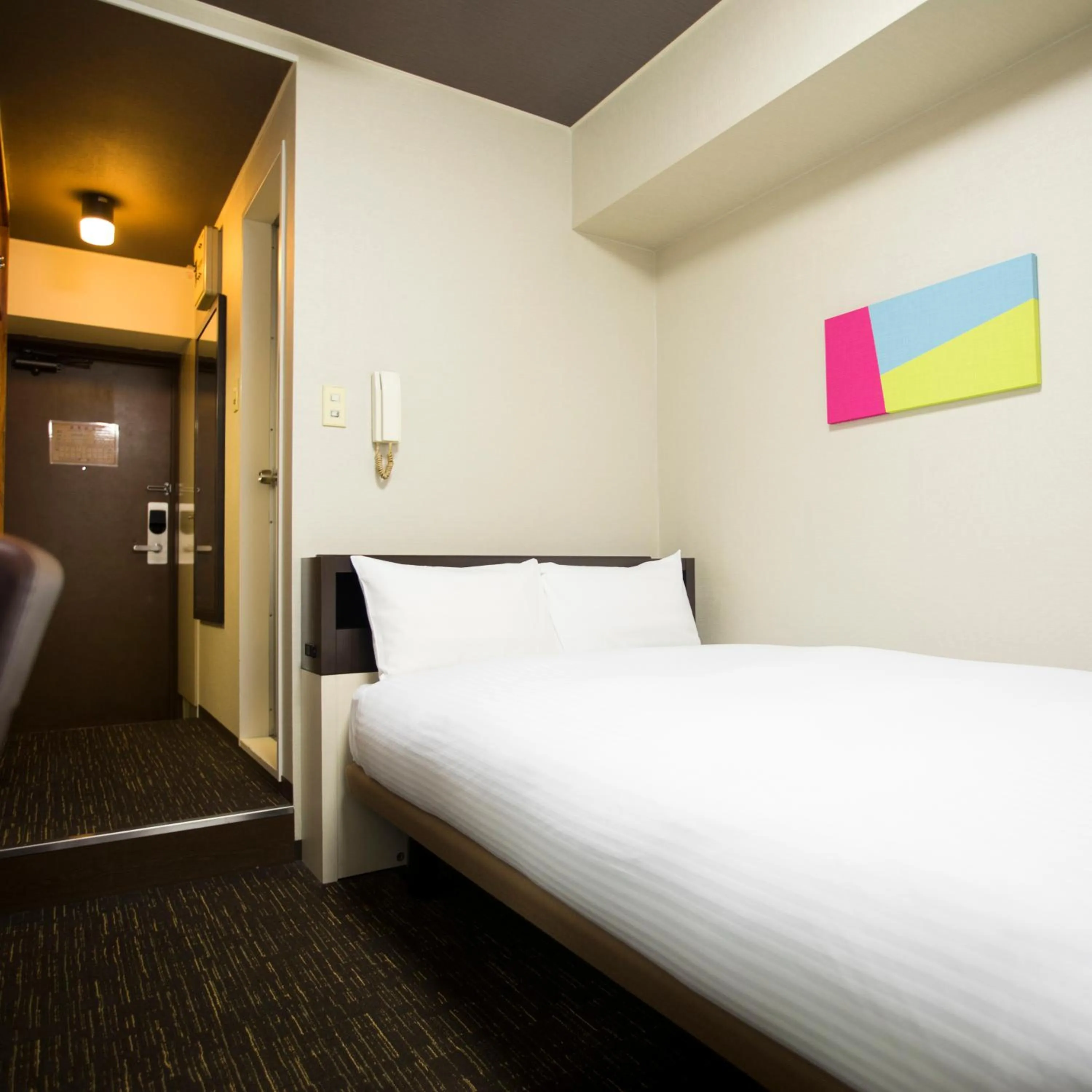 Bed in FLEXSTAY INN Kawasaki Kaizuka