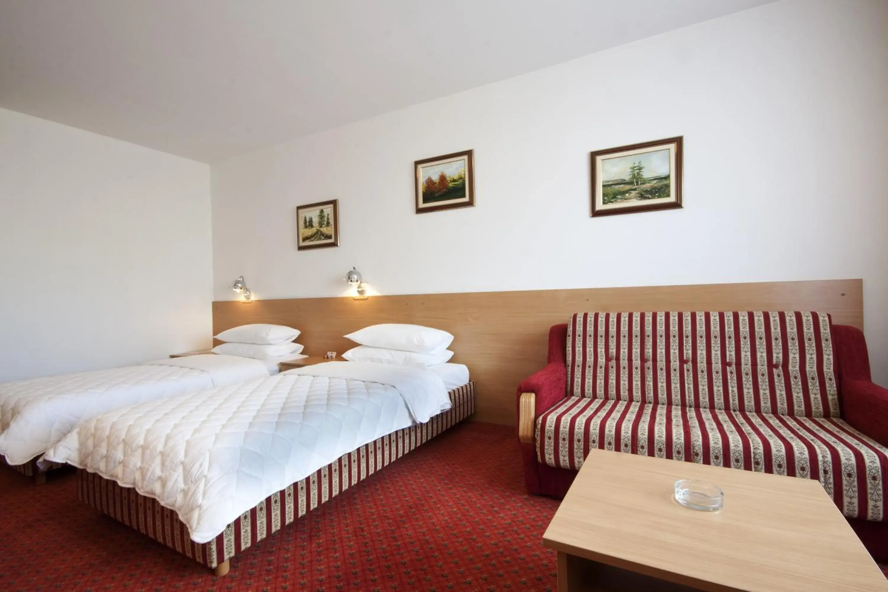 Seating area, Bed in Hotel Grand