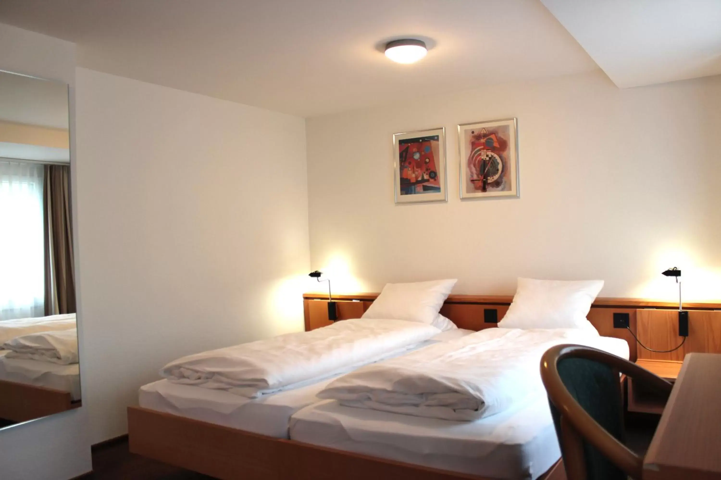 Bed in Hotel Freihof Swiss Lodge