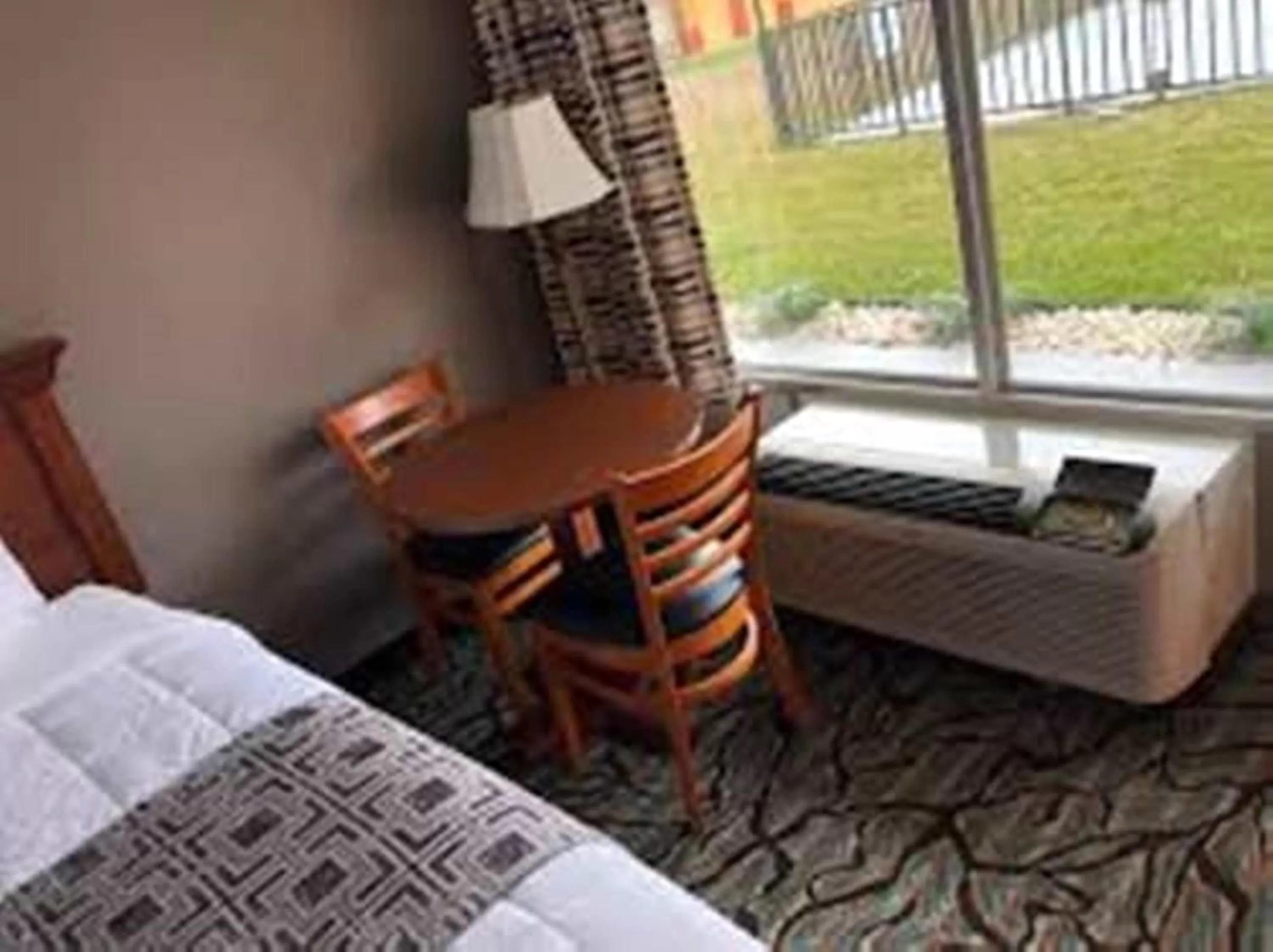 Seating area, Bed in Baymont by Wyndham Walterboro