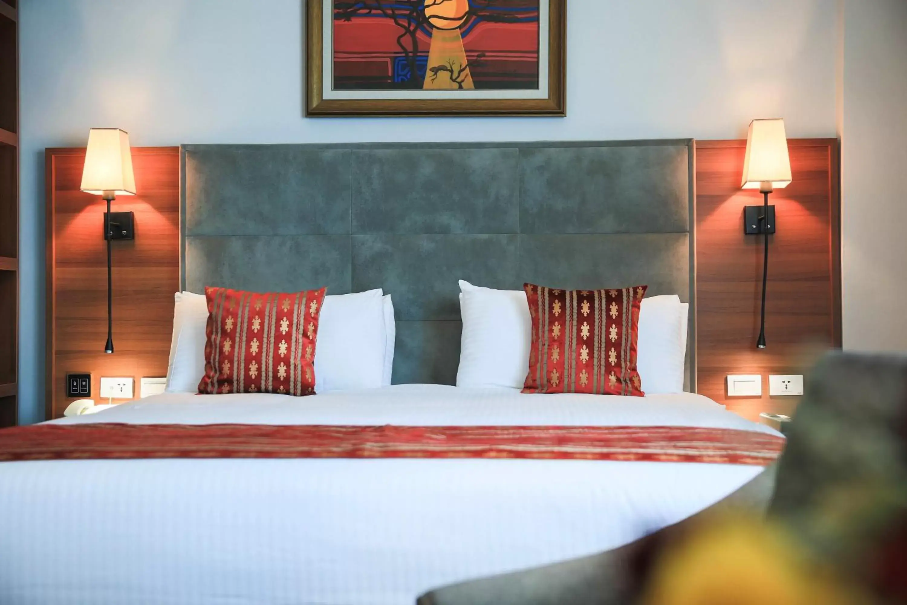 Bed in Swiss Inn Nexus Hotel