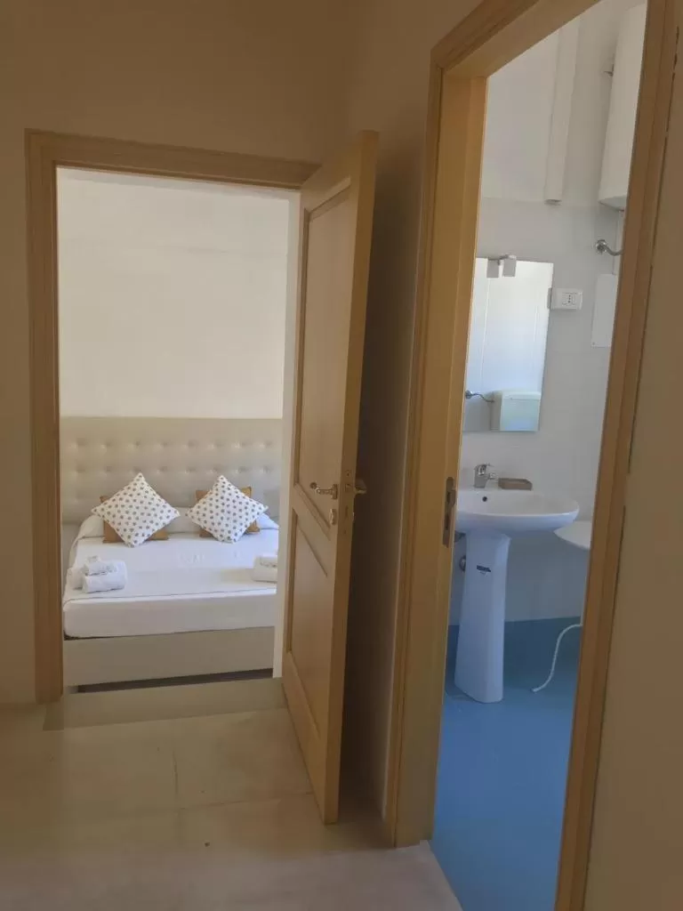 Bed in Landolina Palace Hotel