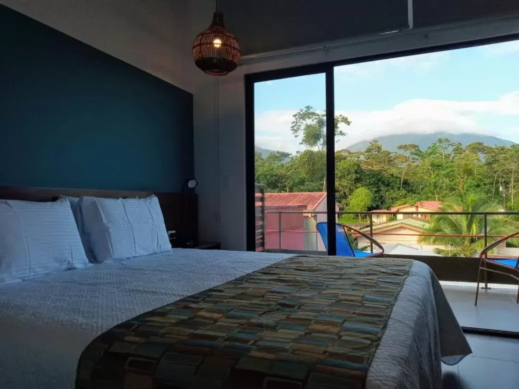 Bedroom, Bed in La Fortuna Lodge by Treebu Hotels