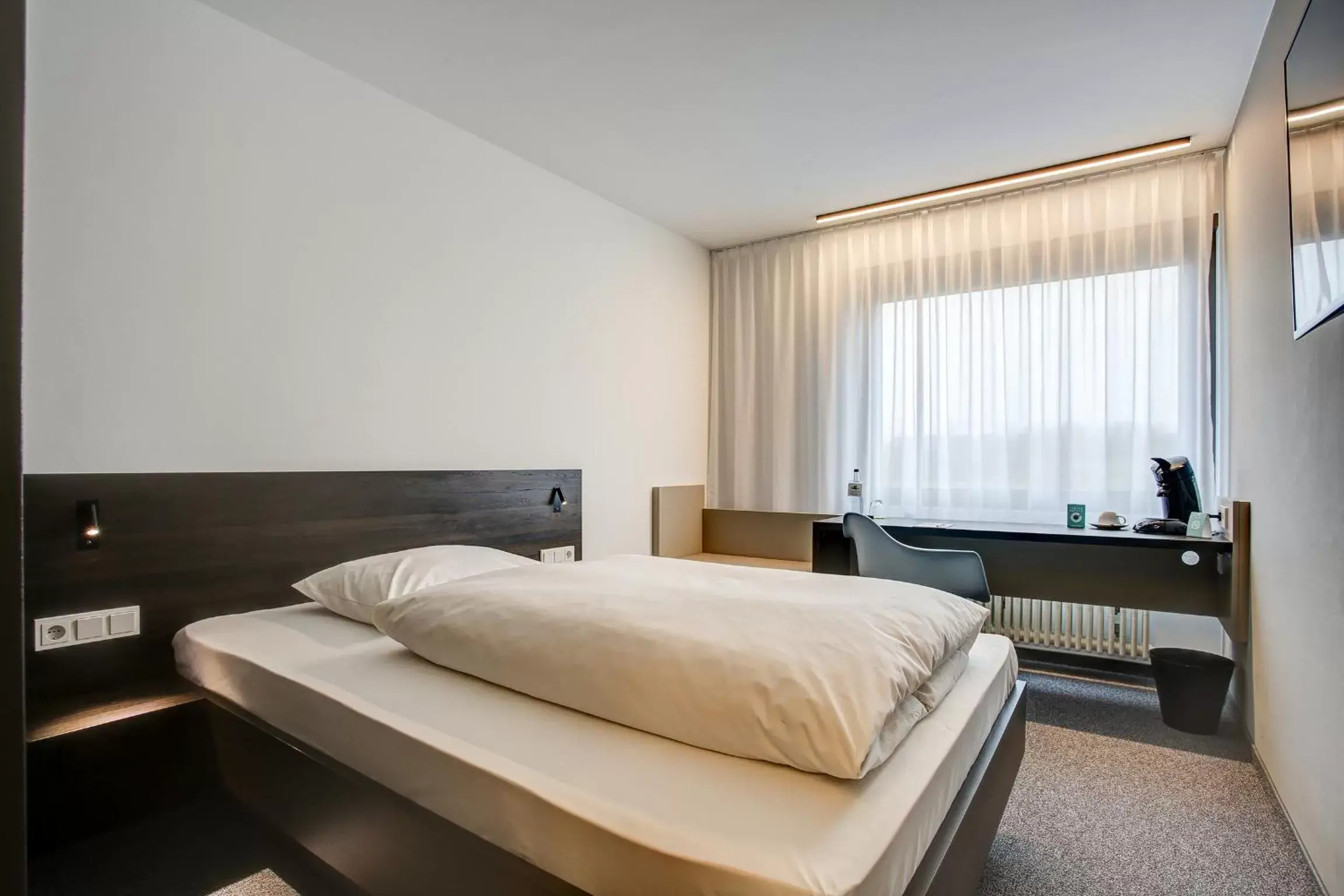 Photo of the whole room, Bed in Centro Parkhotel Stuttgart