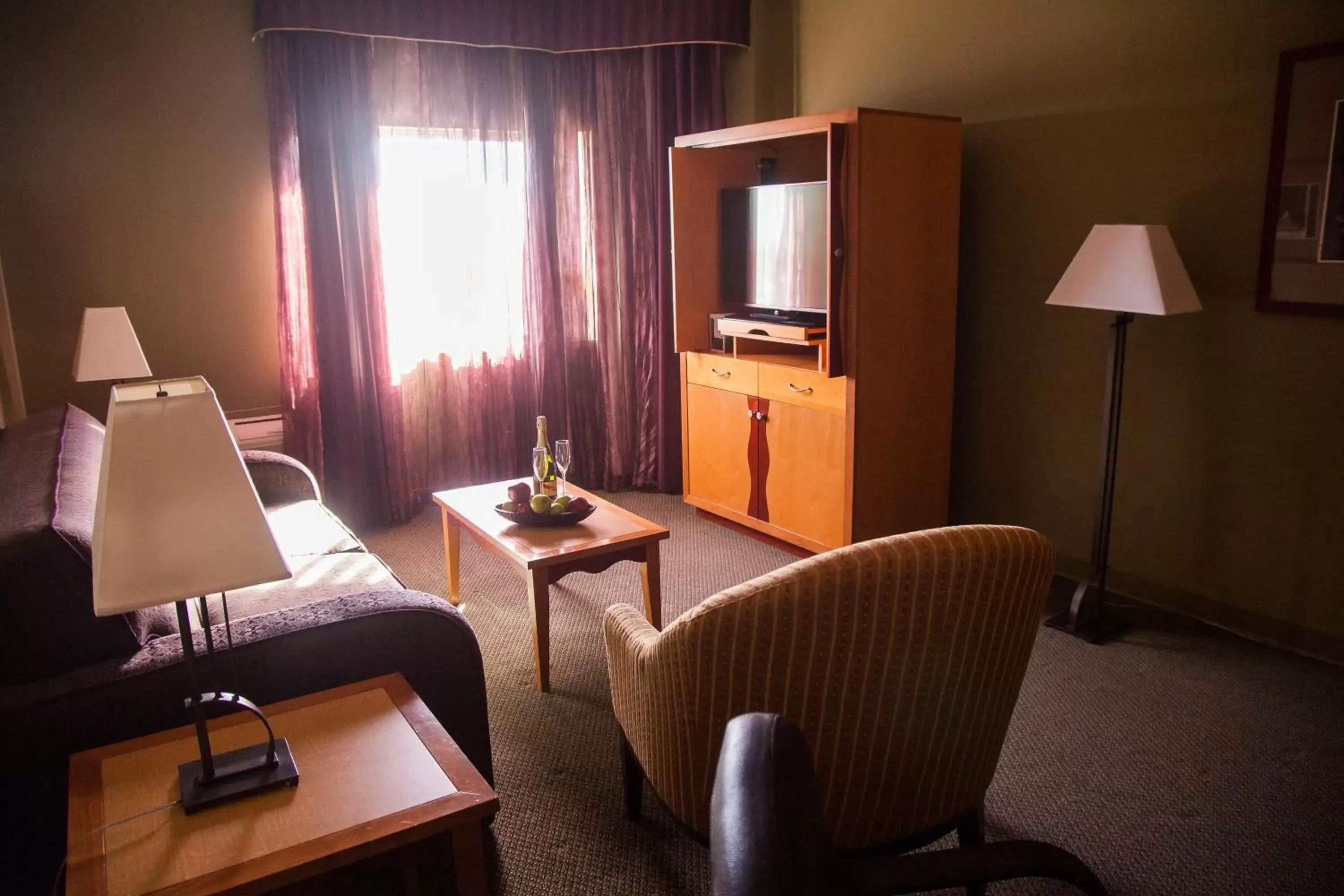 Living room, Seating Area in Medicine Hat Lodge, Trademark Collection by Wyndham