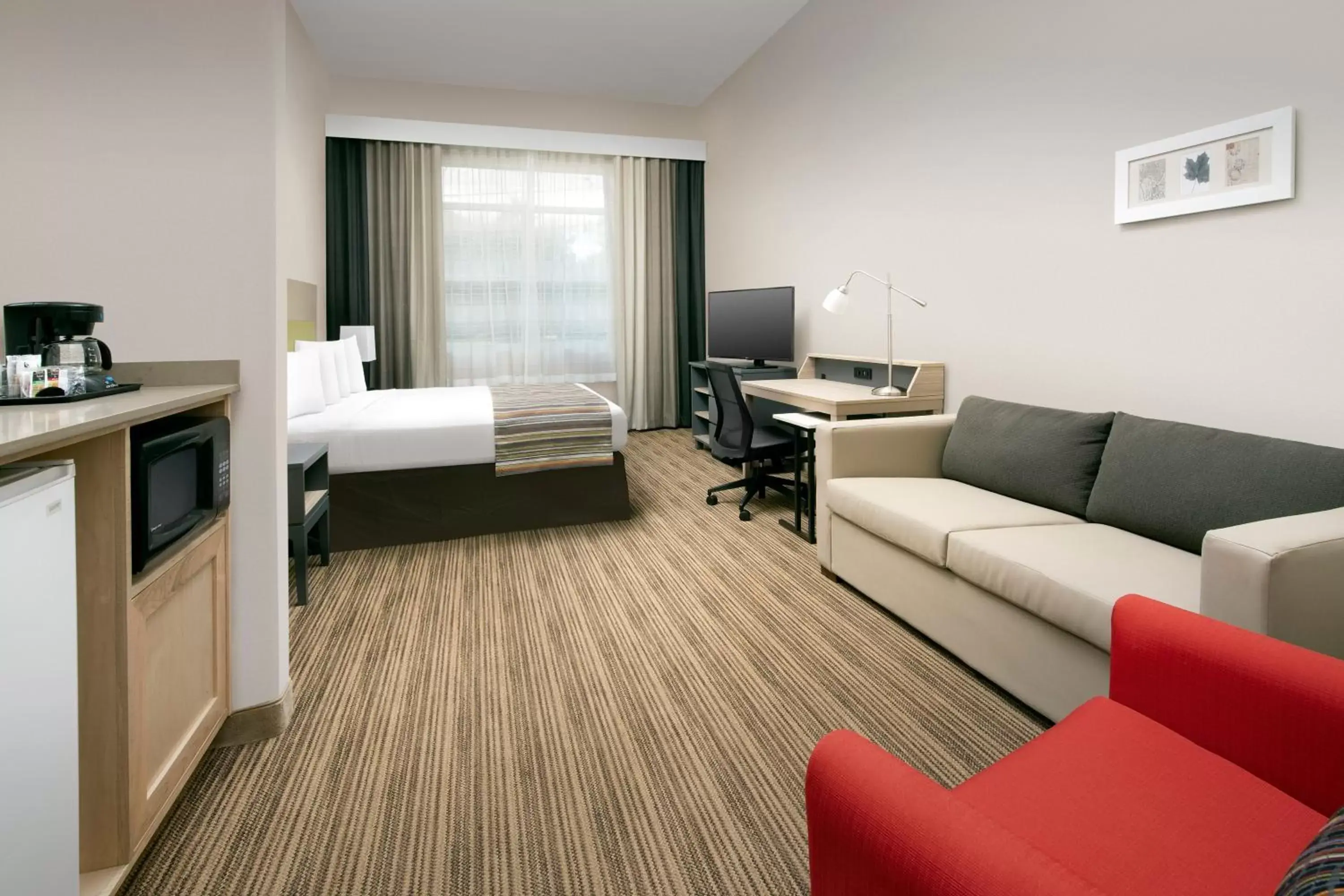 Living room, Seating Area in Country Inn & Suites by Radisson, Houston Intercontinental Airport East, TX