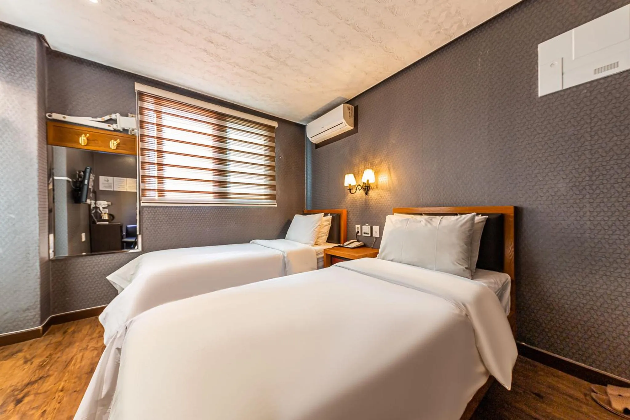 Bed in Friendly DH Naissance Hotel by Mindrum Group