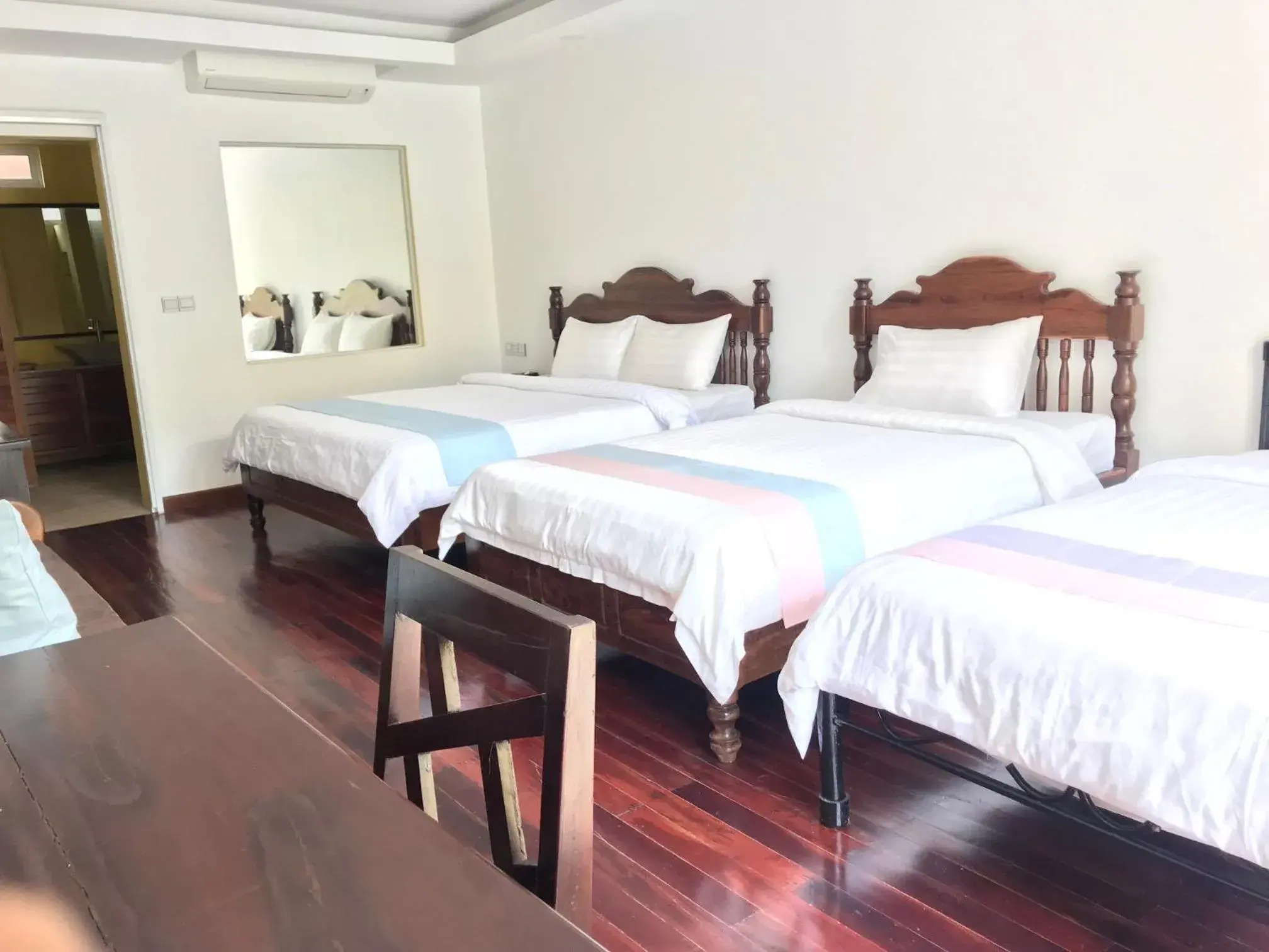 Bed in La Residence Watbo Hotel