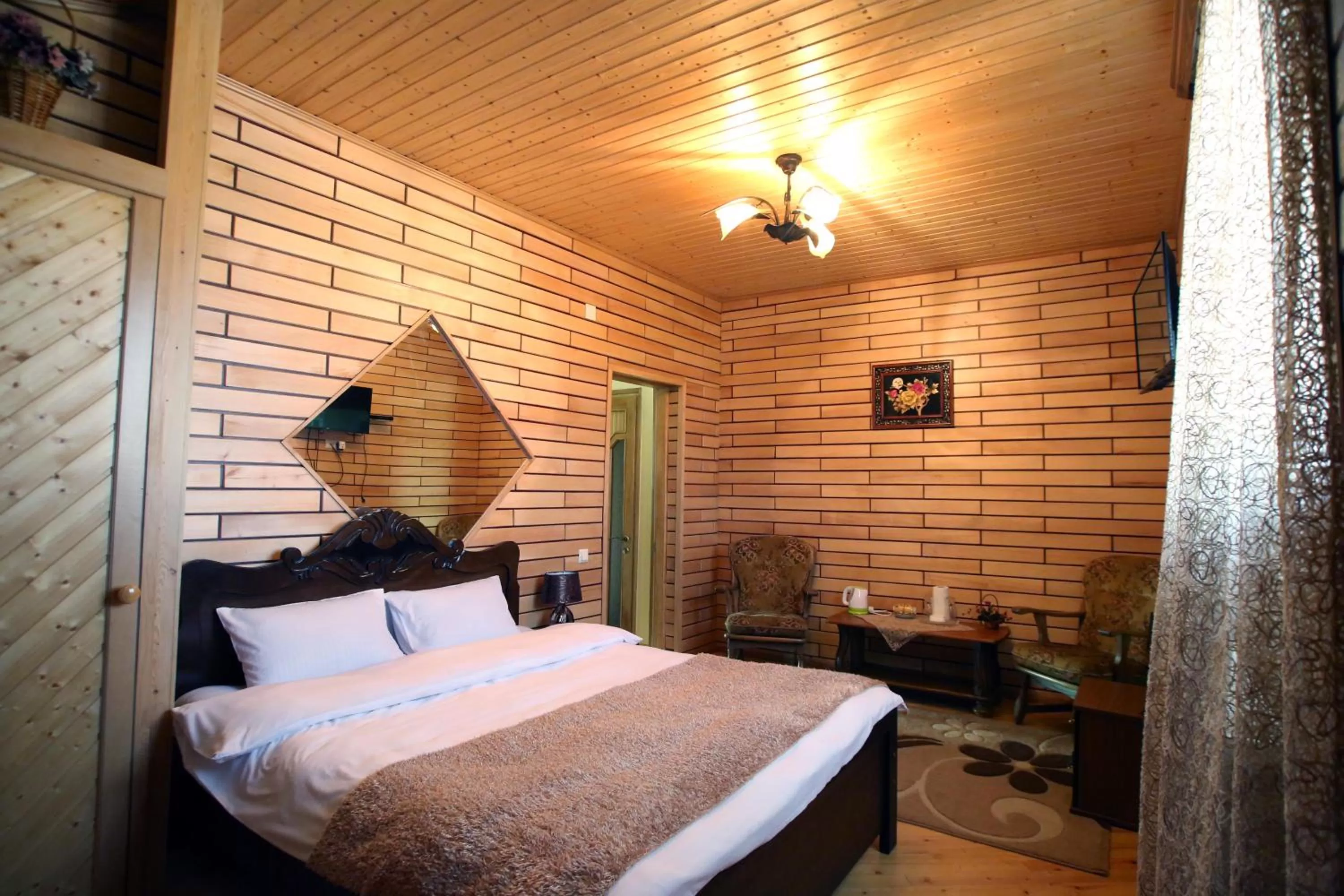 Living room, Bed in Hotel Harmony