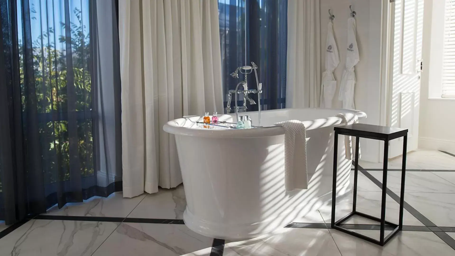 Bathroom in The Manor House at the Queen Victoria Hotel by NEWMARK