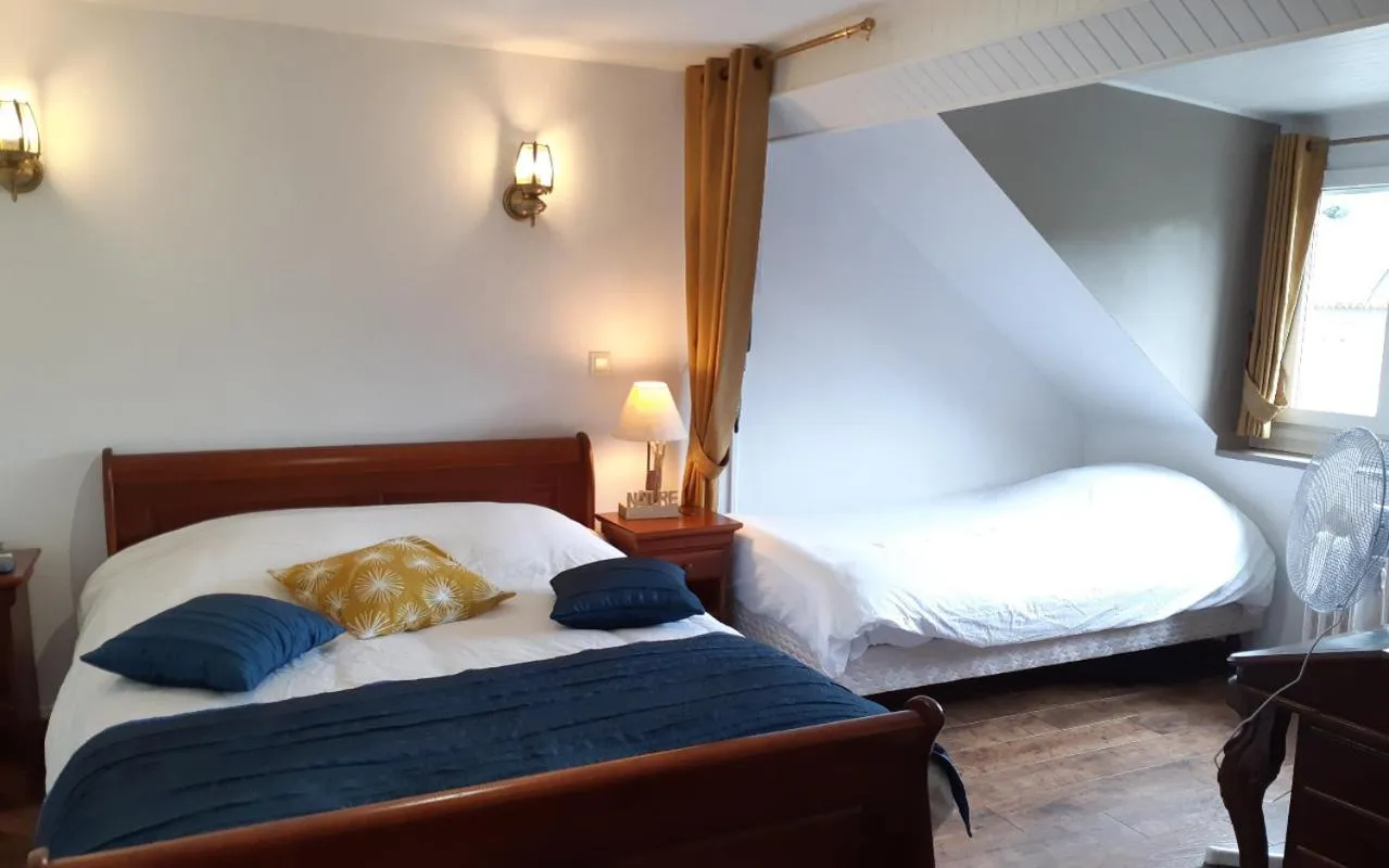 Bed in Logis Le Saint Hubert