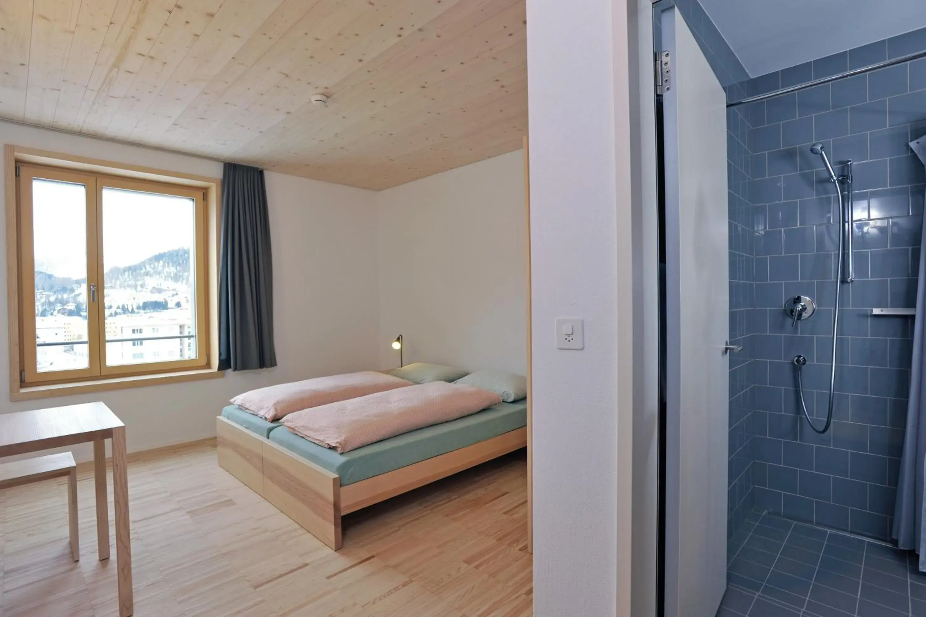 Shower, Bed in St. Moritz Youth Hostel