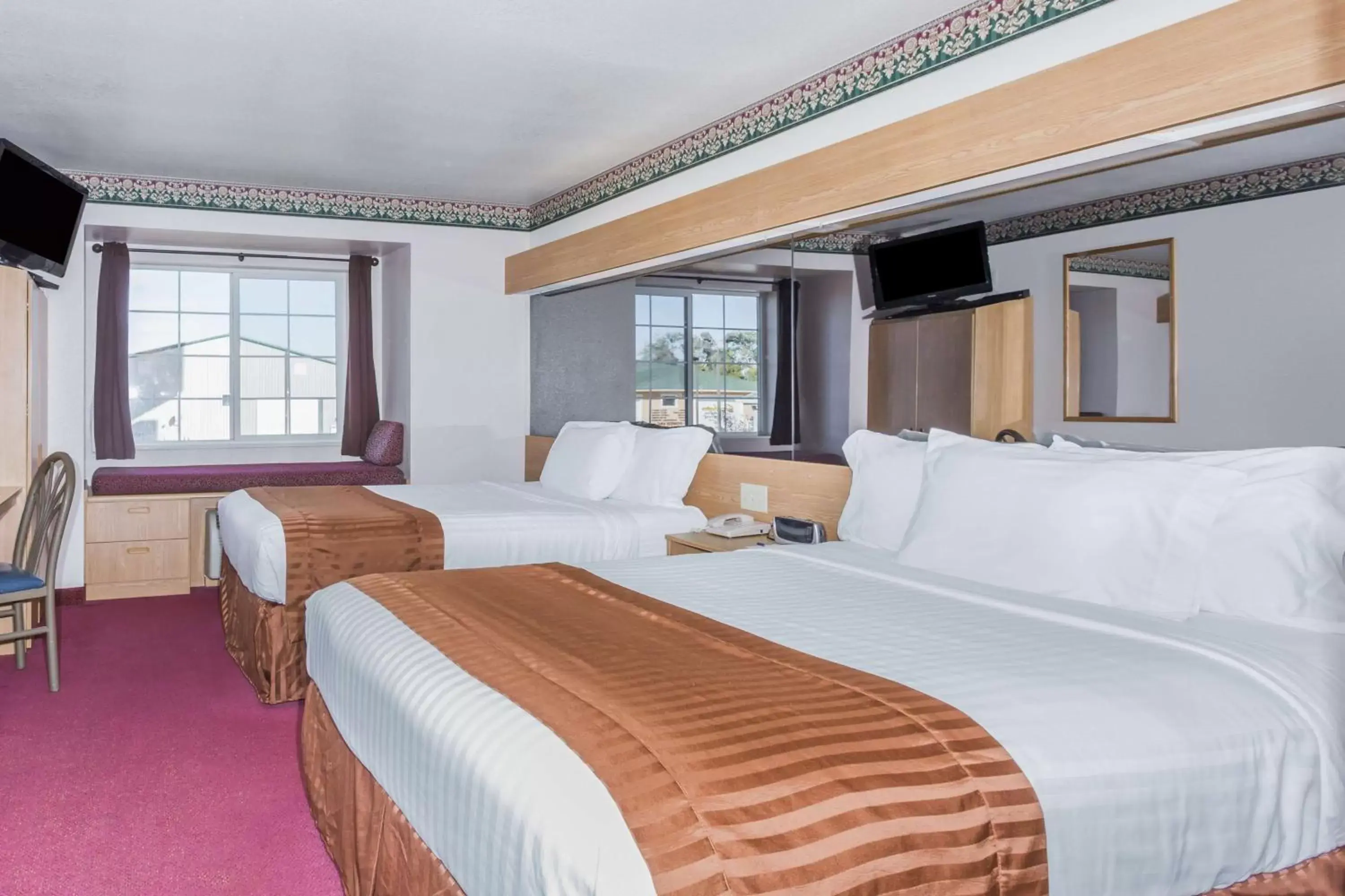 Queen Room with Two Queen Beds - Non-Smoking in Boarders Inn & Suites by Cobblestone Hotels - Brush