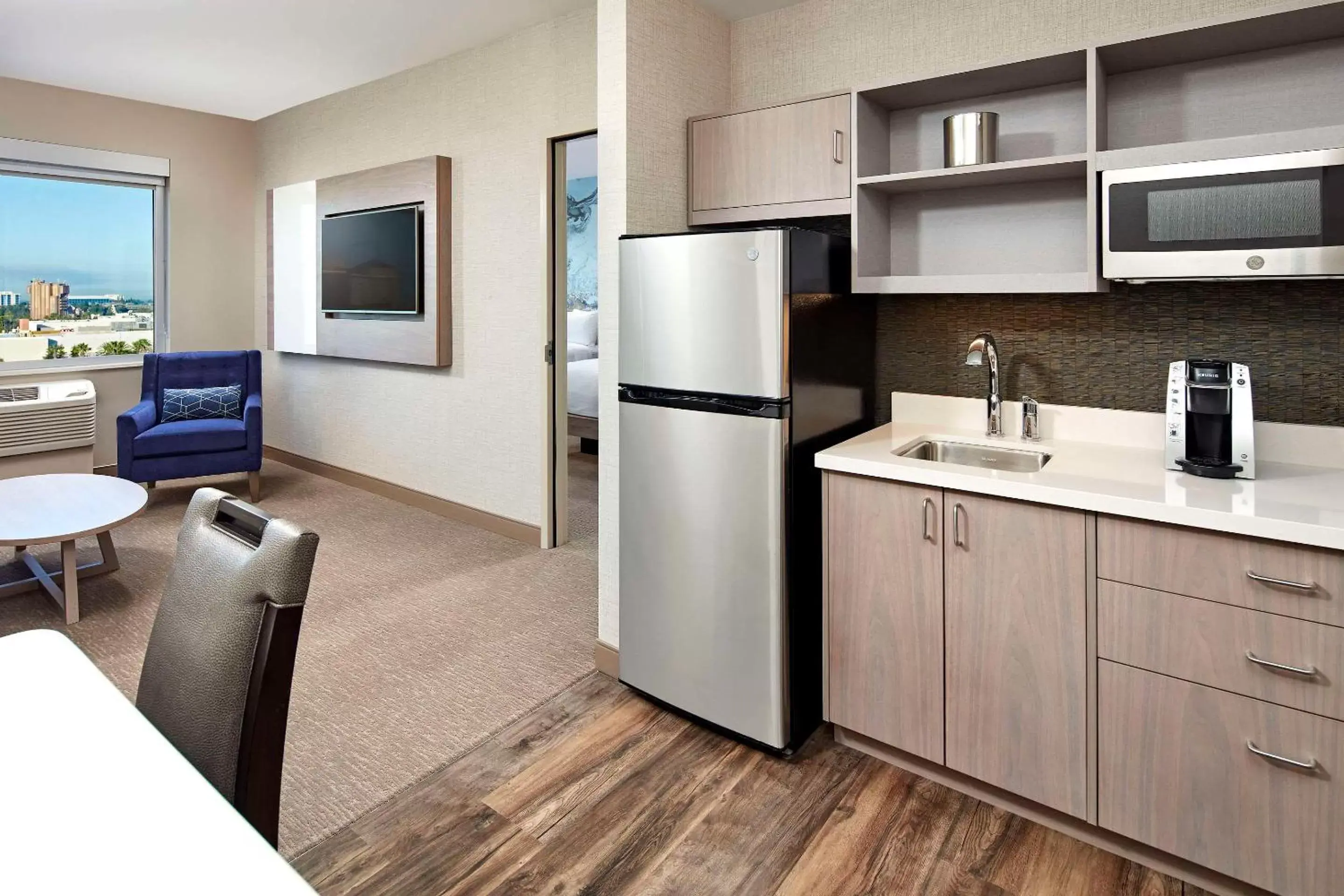 Bedroom, Kitchen/Kitchenette in Cambria Hotel & Suites Anaheim Resort Area