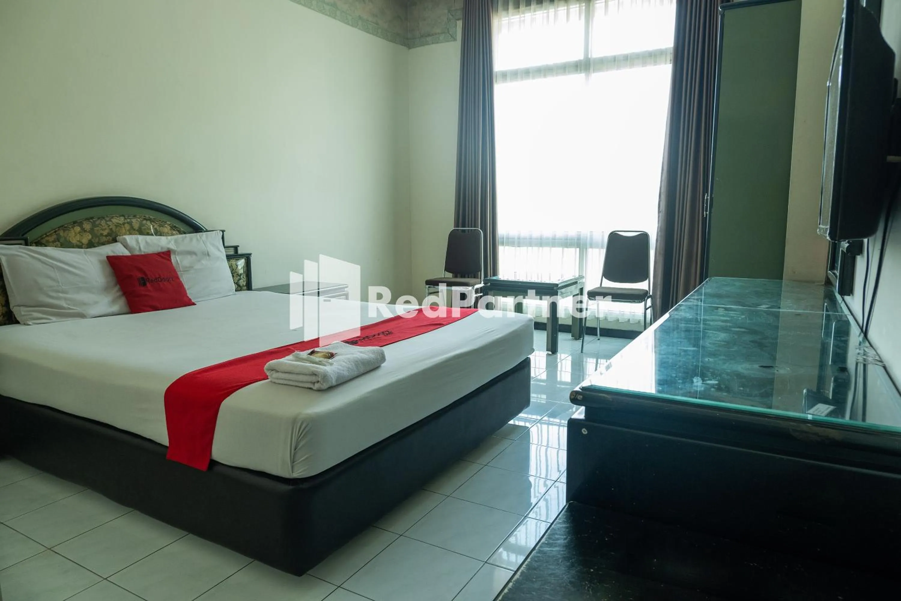 Bed in Akur Hotel Malioboro Mitra RedDoorz