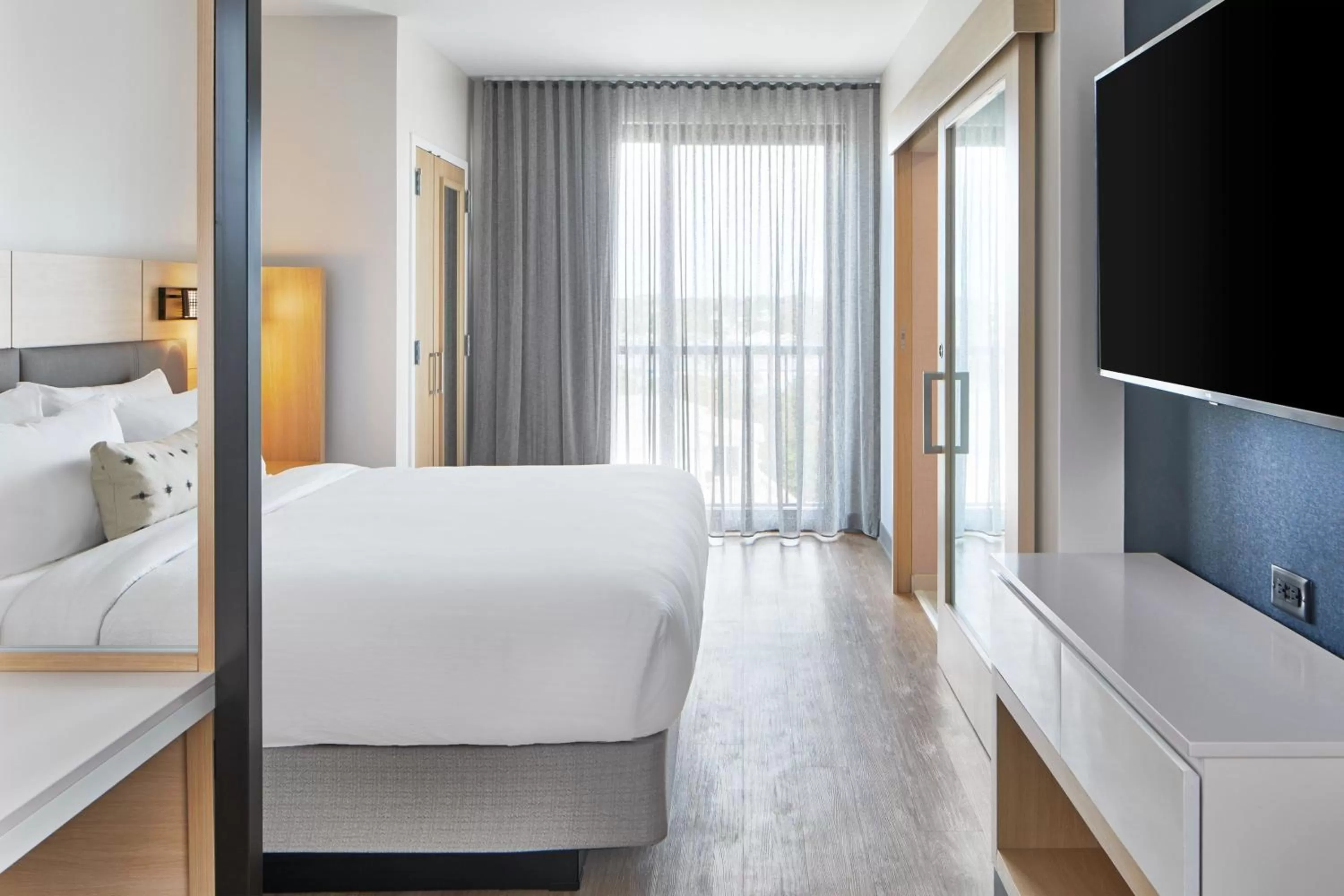 Photo of the whole room, Bed in SpringHill Suites by Marriott Jacksonville Beach Oceanfront