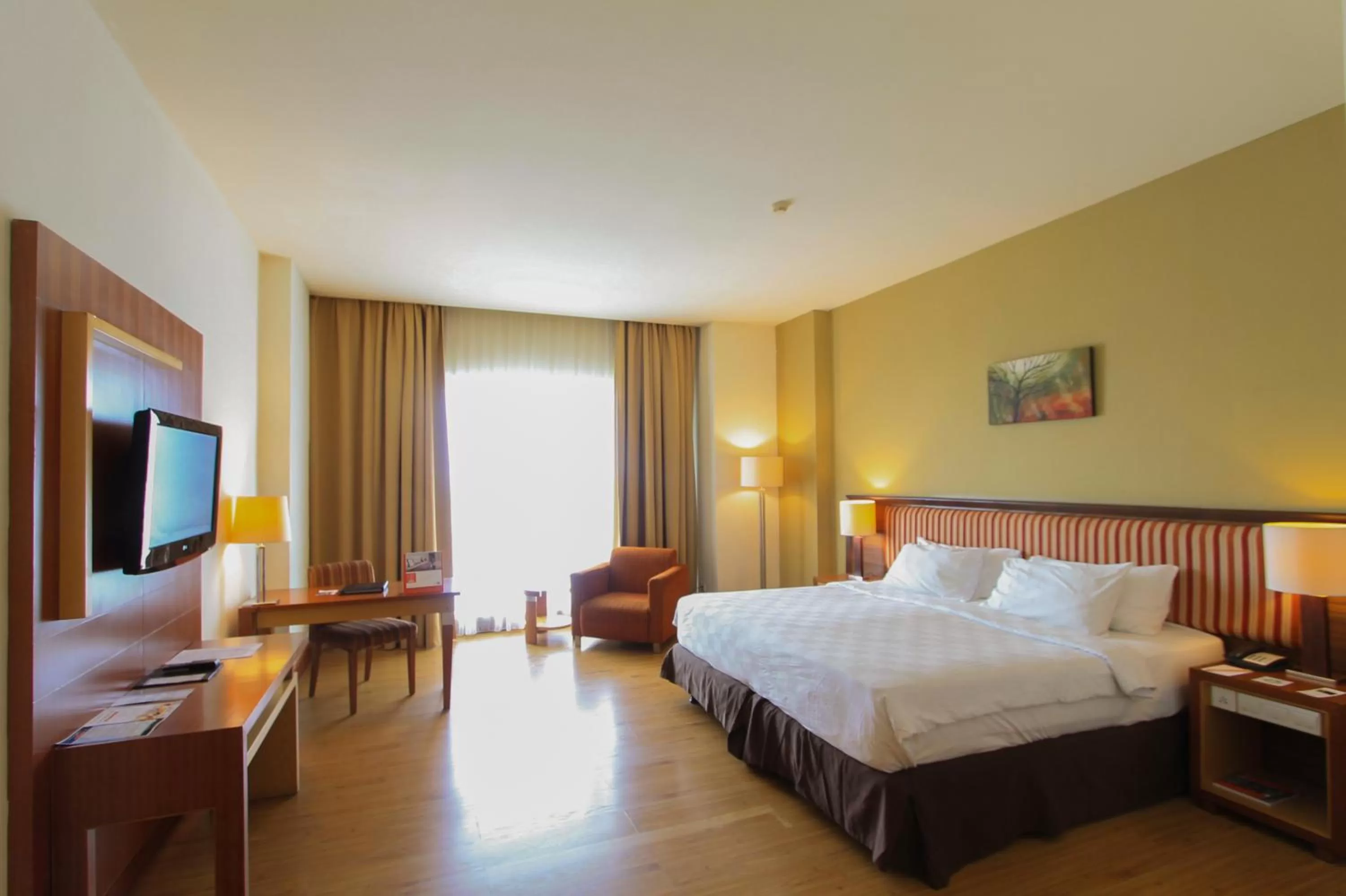 Photo of the whole room, Bed in Swiss-Belhotel Maleosan Manado